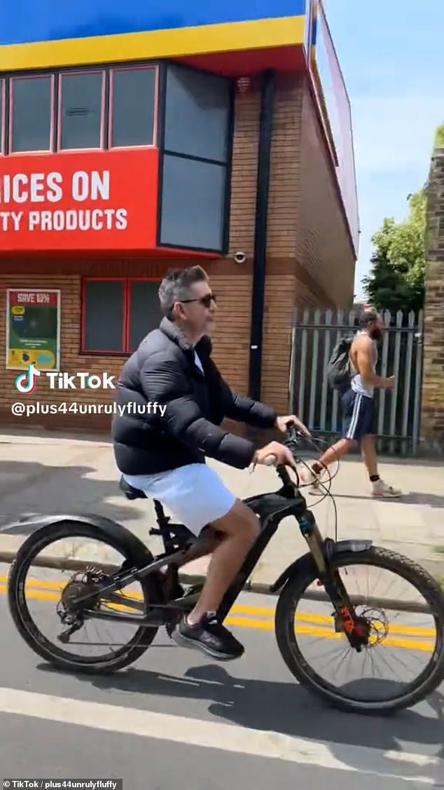 The music mogul, who broke his back after falling from a similar model in 2020, was spotted by a fan as he cycled through the busy streets and even stopped for a chat outside a pub