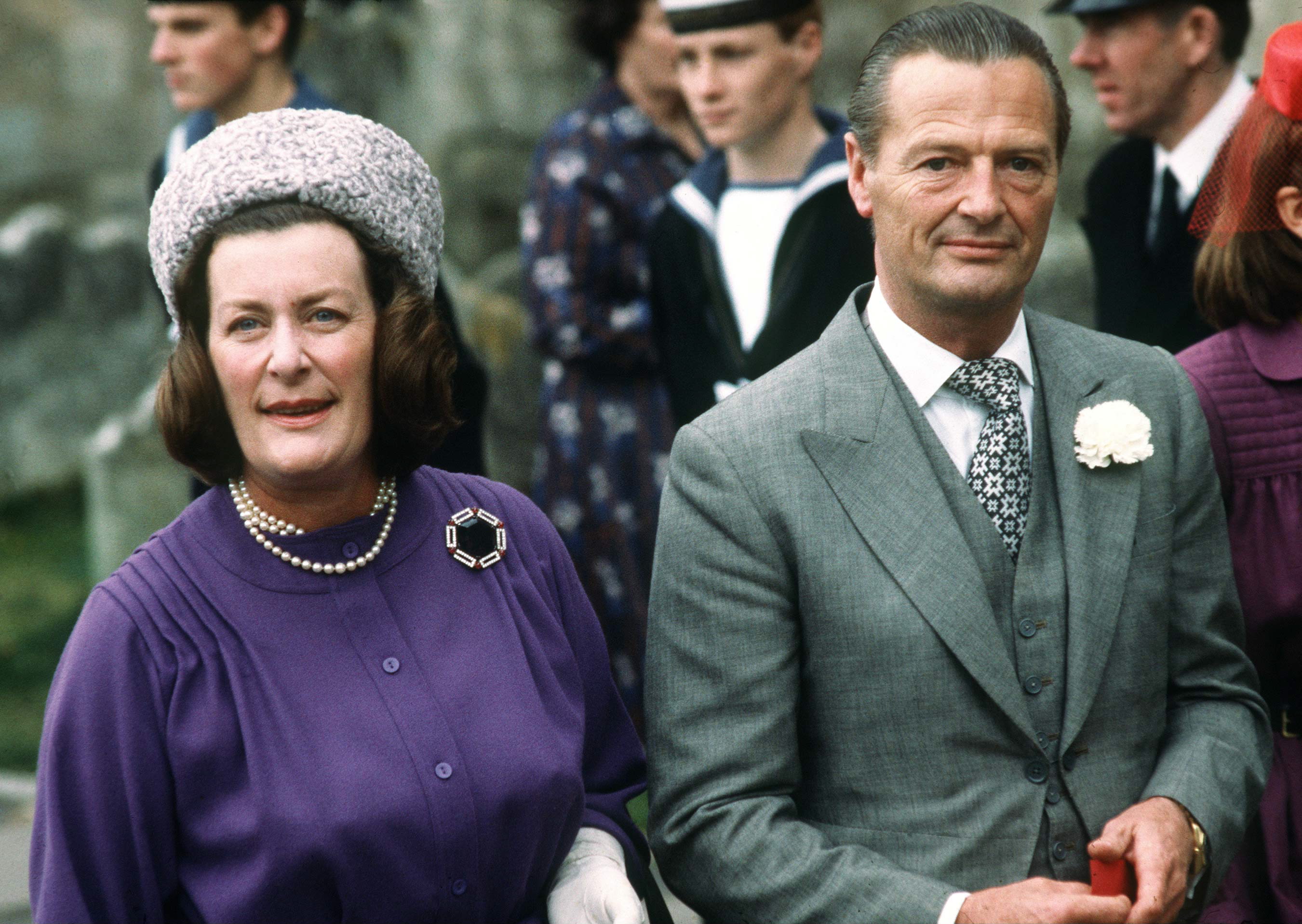 Taken on 20 October 1979 in Romsey, Lady Pamela Hicks stands beside her husband at the wedding of Norton Knatchbull, the couple appearing composed and elegantly dressed as they attend the family occasion together among fellow guests.