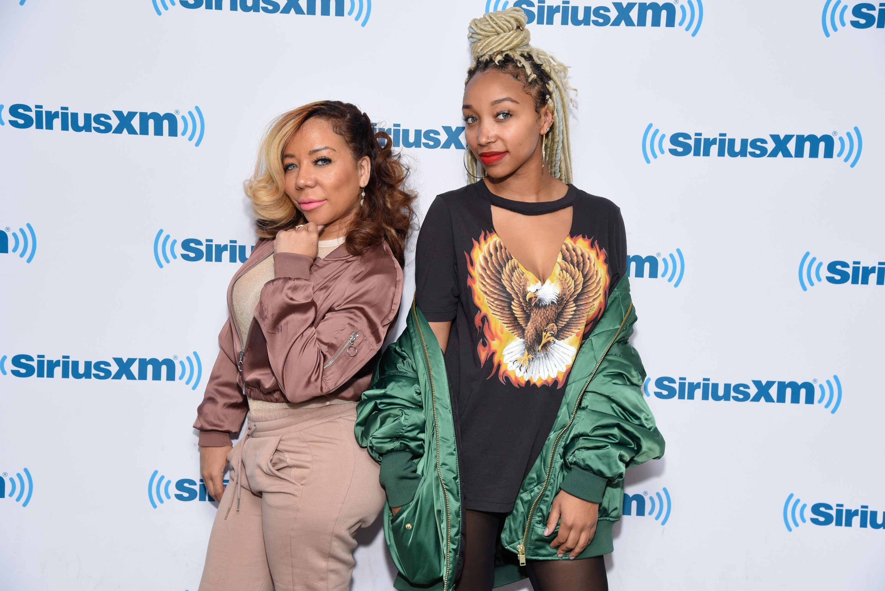 Tameka "Tiny" Harris (L) and Zonnique Jailee Pullins at the SiriusXM Studios on April 19, 2017 in New York City | Photo: Getty Images