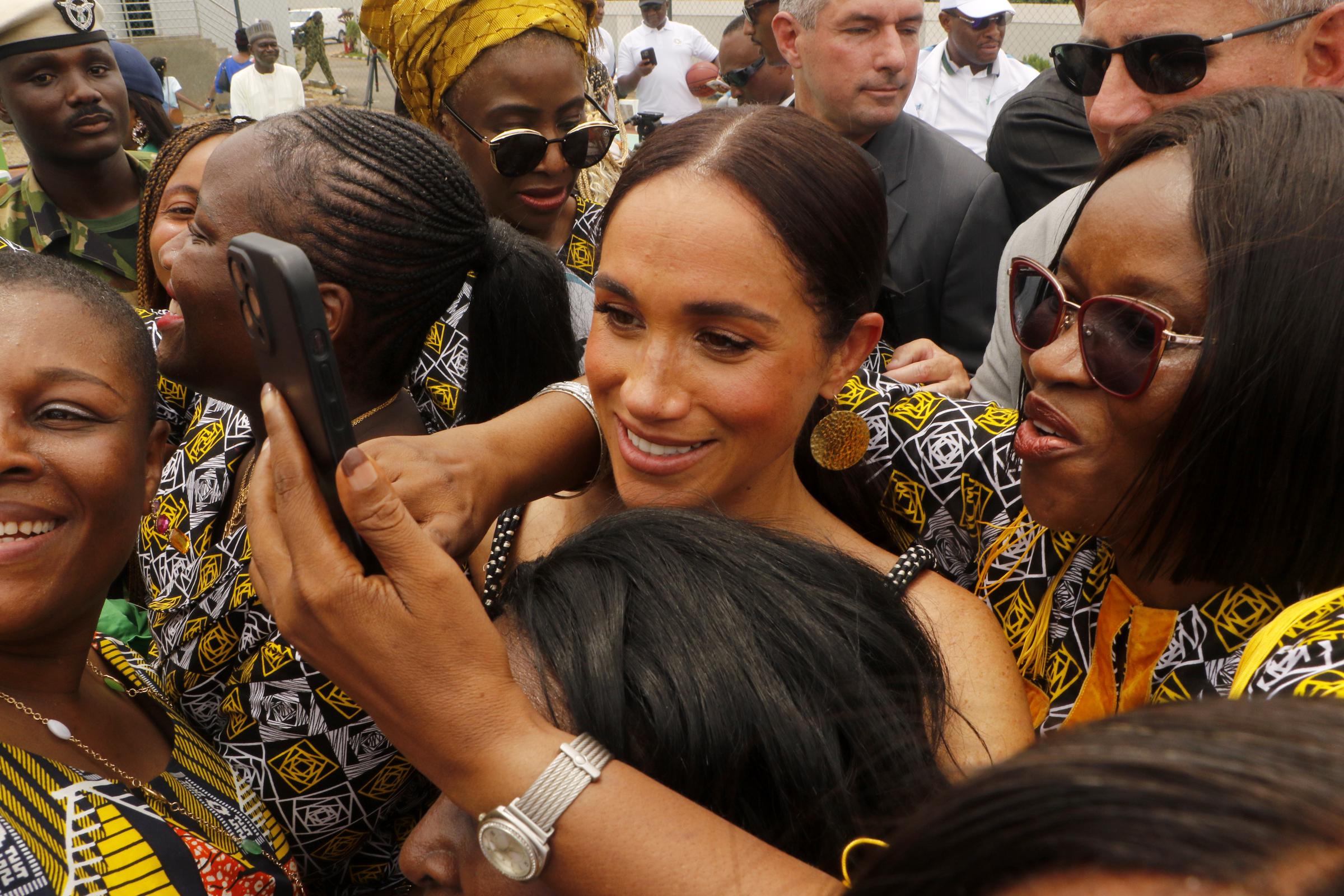 Meghan Markle attracts a crowd at a sitting volleyball exhibition at Nigeria Unconquered in Abuja, Nigeria, during the Invictus Games anniversary celebrations on May 11, 2024. | Source: Getty Images