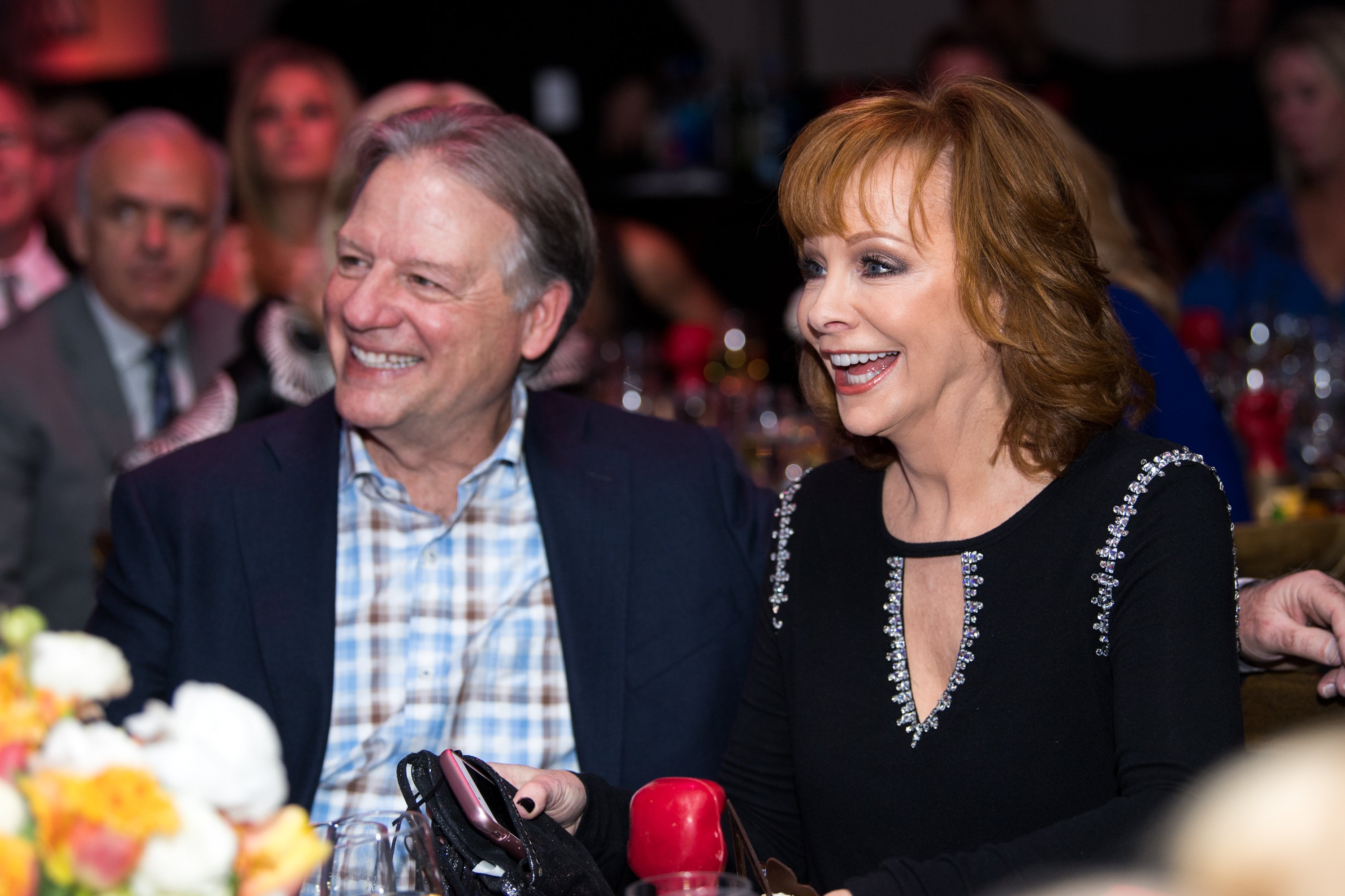 Anthony Lasuzzo (L) and Reba McEntire attend the Celebrity Fight Night's Founders Club Dinner on March 9, 2018, in Phoenix, Arizona. | Source: Getty Images.