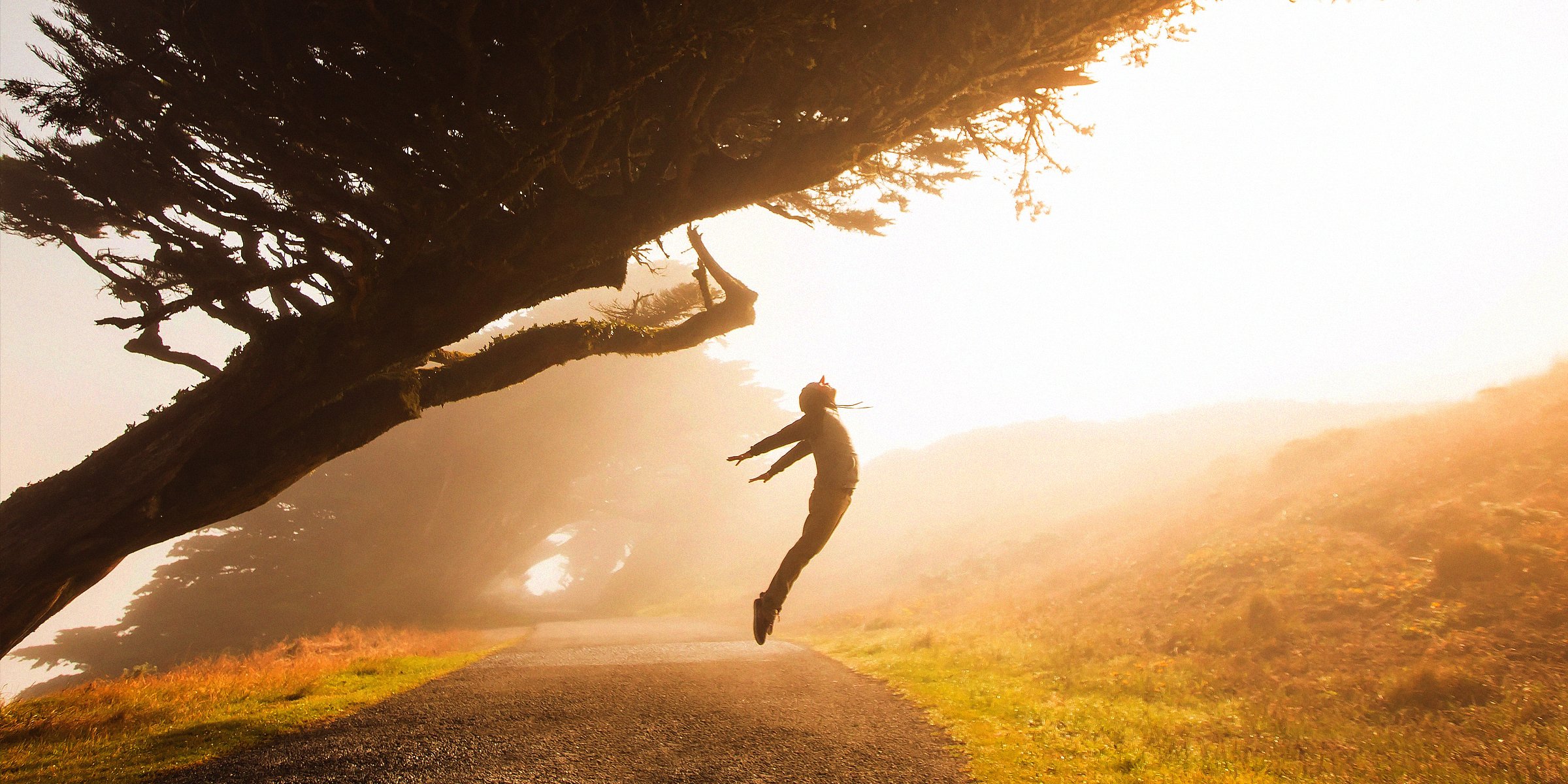 An excited person taking a leap at sunrise | Source: Unsplash.com