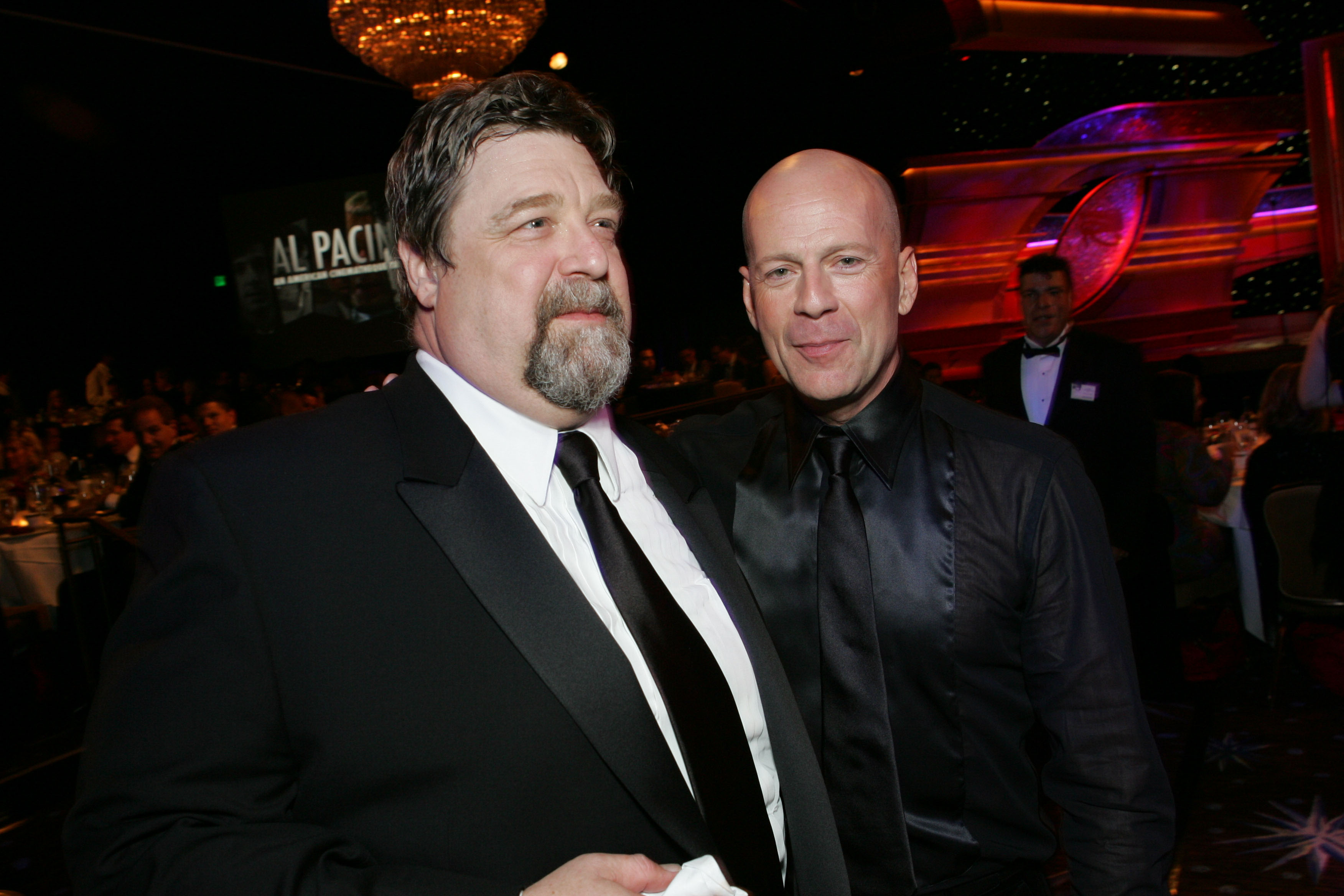 John Goodman and Bruce Willis during the 20th Annual American Cinematheque Award Honoring Al Pacino at Beverly Hilton Hotel in Beverly Hills, California, United States | Source: Getty Images