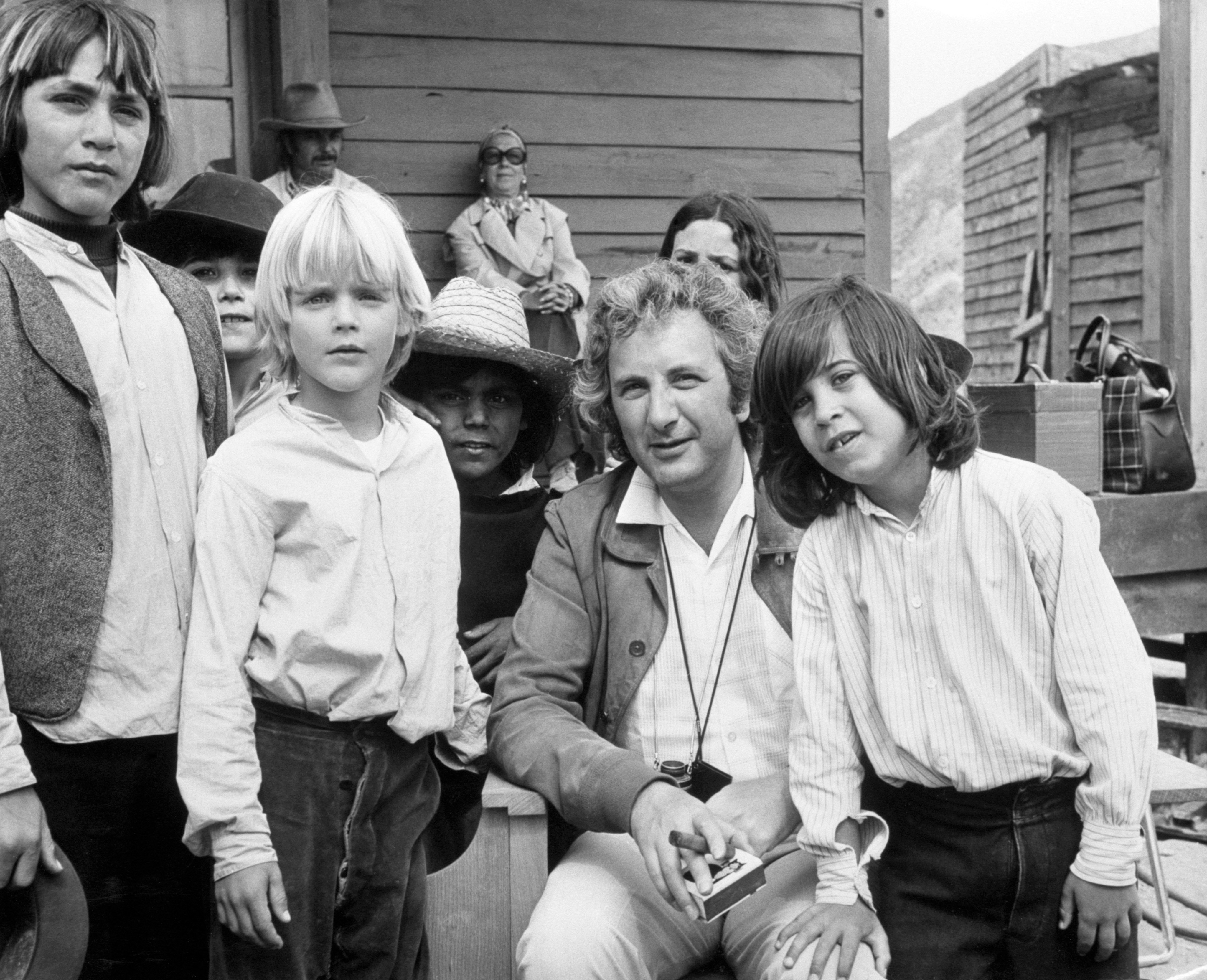 Michael Winner on the set of his western Chato's Land, which stars Charles Bronson. Two of the young actors with him, Jason (right) and Valentine (blond, centre), are sons of British actors Jill Ireland and David McCallum. | Source: Getty Images