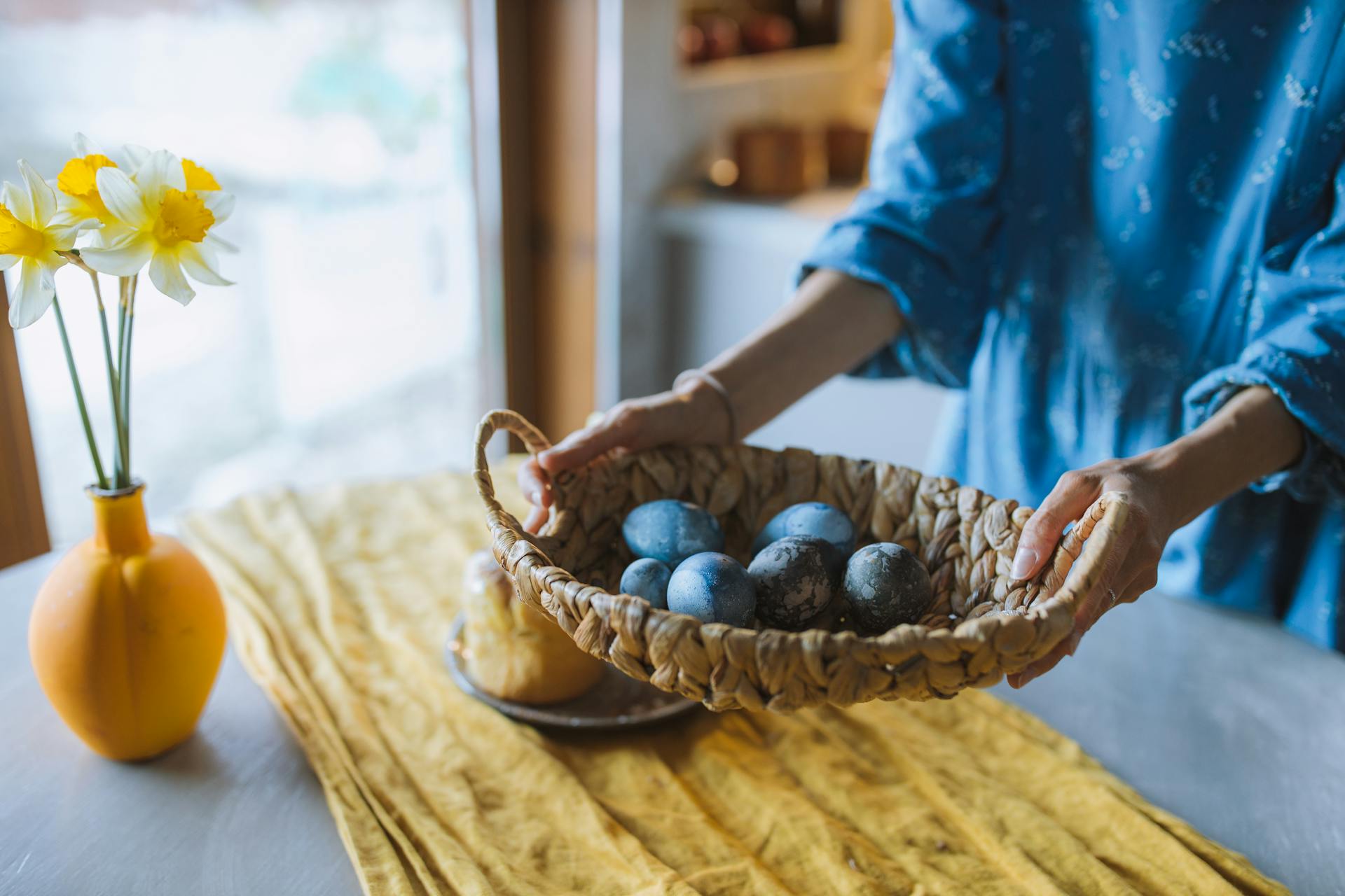 A woman holding an egg basket | Source: Pexels