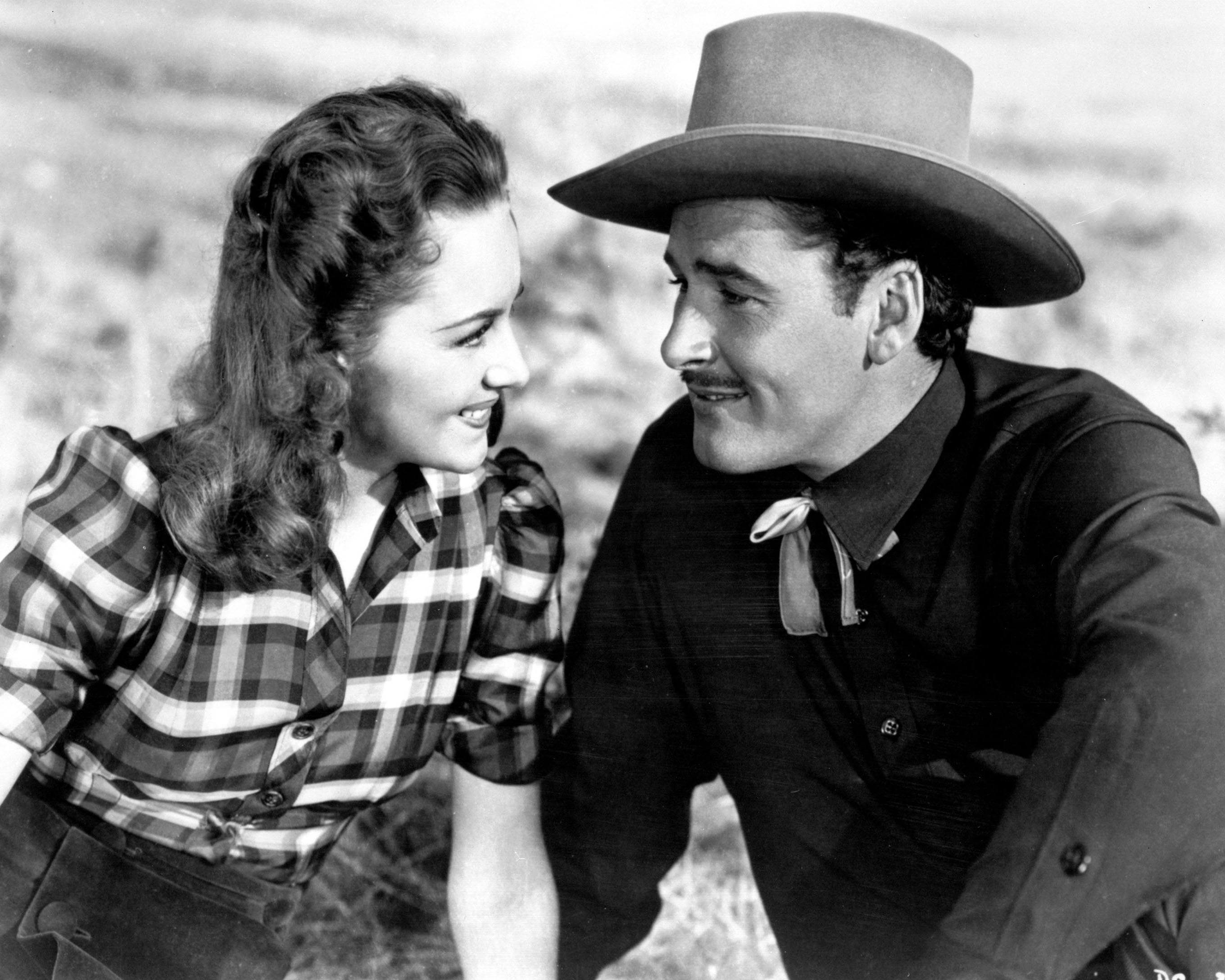 Olivia de Havilland and Errol Flynn in the western movie "Dodge City," in 1939. | Source: Silver Screen Collection/Getty Images