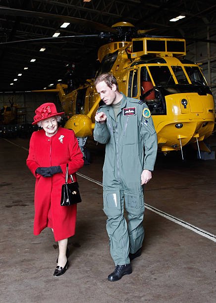 Queen Elizabeth II and Prince William during a visit to RAF Valley on April 1, 2011 in Holyhead, United Kingdom | Photo: Getty Images