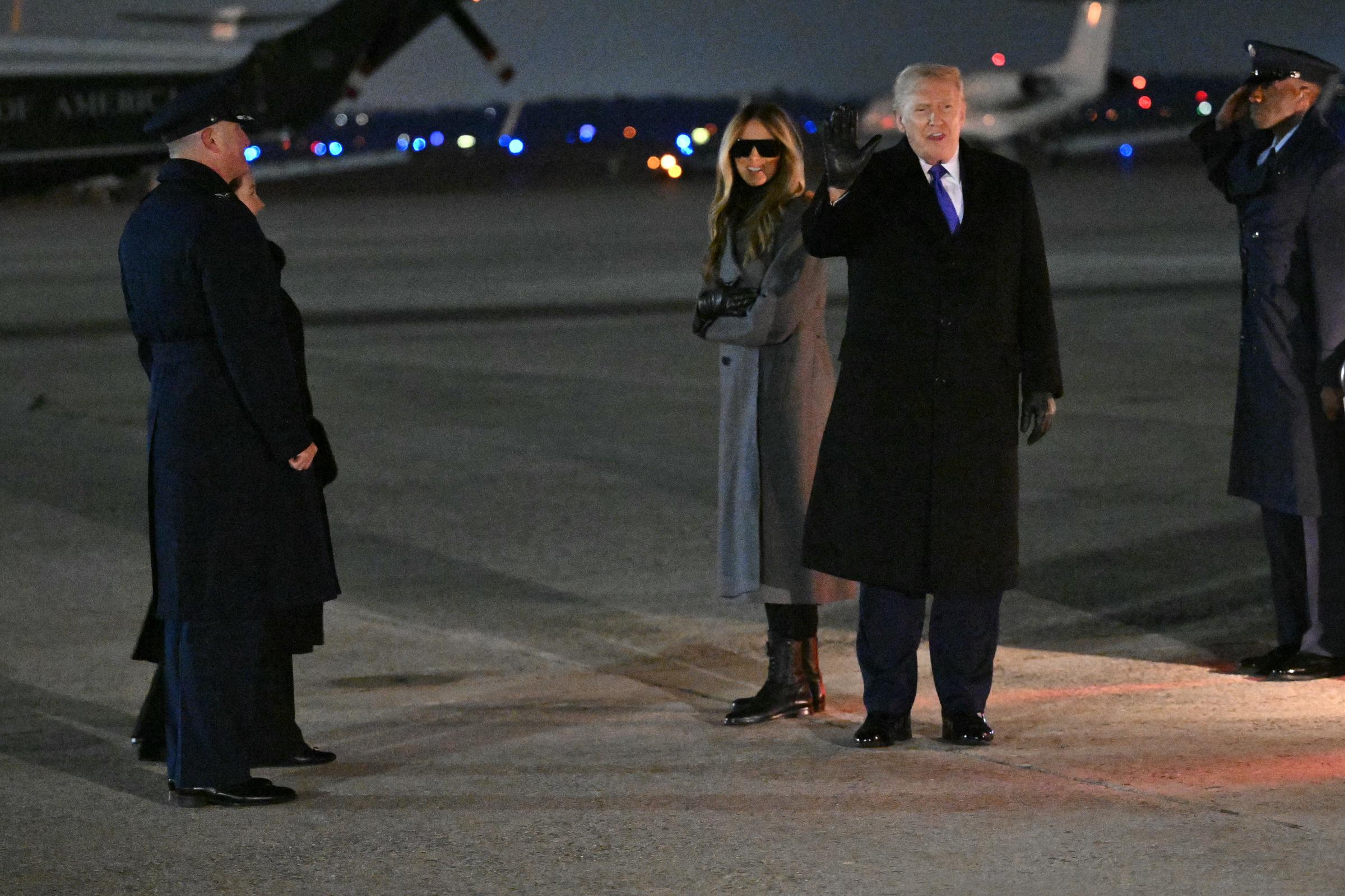 Donald Trump and Melania Trump greet the press upon arrival at Joint Base Andrews on February 16, 2026, in Maryland | Source: Getty Images