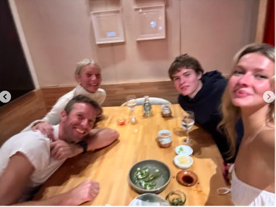 Chris Martin, Gwyneth Paltrow, Moses Martin, and Apple Martin posing for a photo at dinner, posted on June 15, 2025. | Source: Instagram/gwynethpaltrow