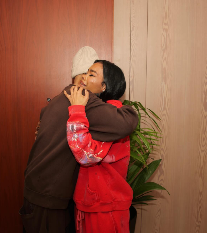 Teyana Taylor and the "special" person share a tight, lingering hug by a doorway, their arms wrapped fully around each other in a moment that feels both comforting and emotional.  | Source: Instagram/teyanataylor
