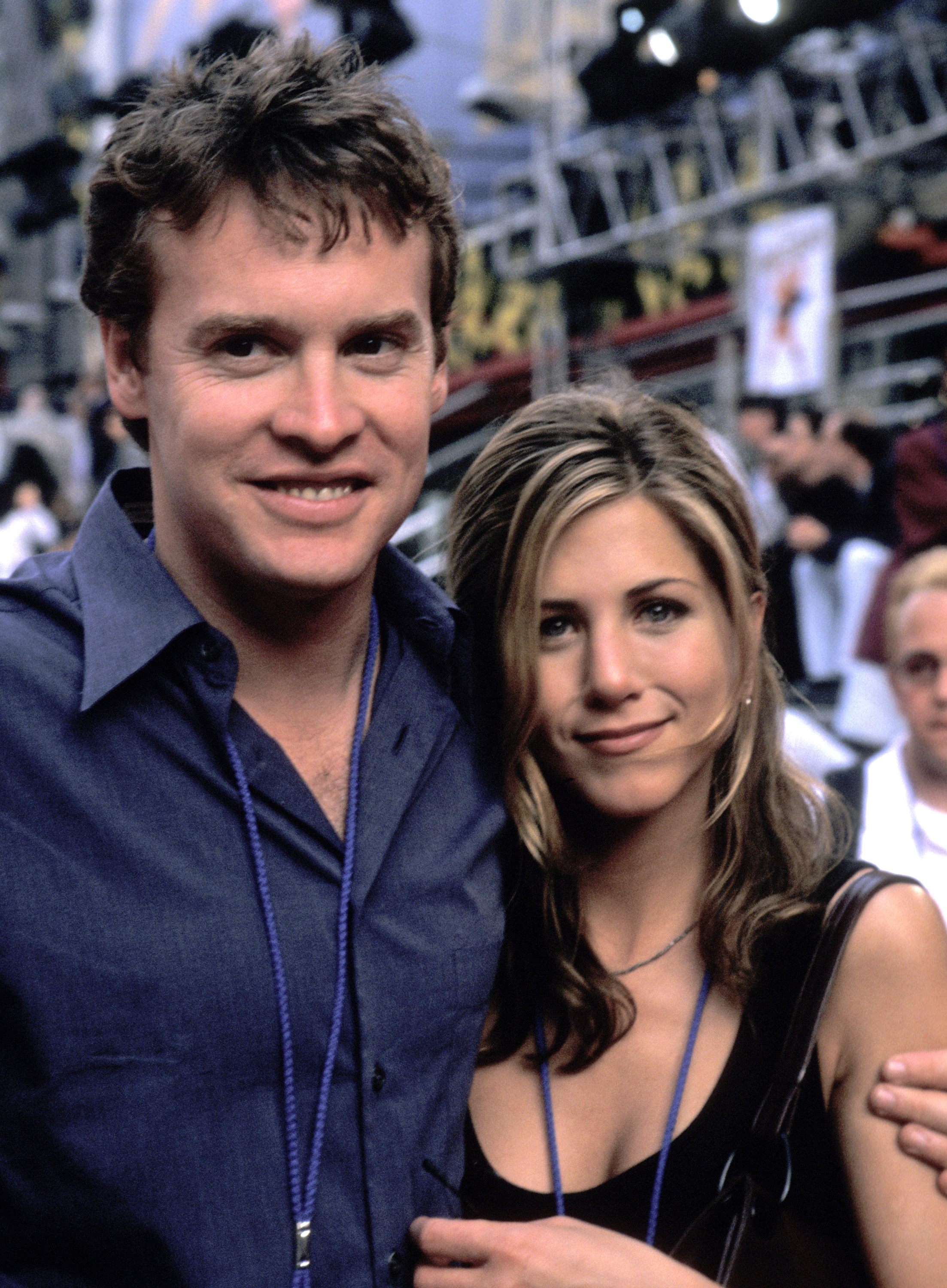 Jennifer Aniston attended the world premiere of "Hercules" with Tate Donovan in June 1997. She wore a black sleeveless top and styled her blonde-highlighted hair in a loose, shoulder-length look with a side part.