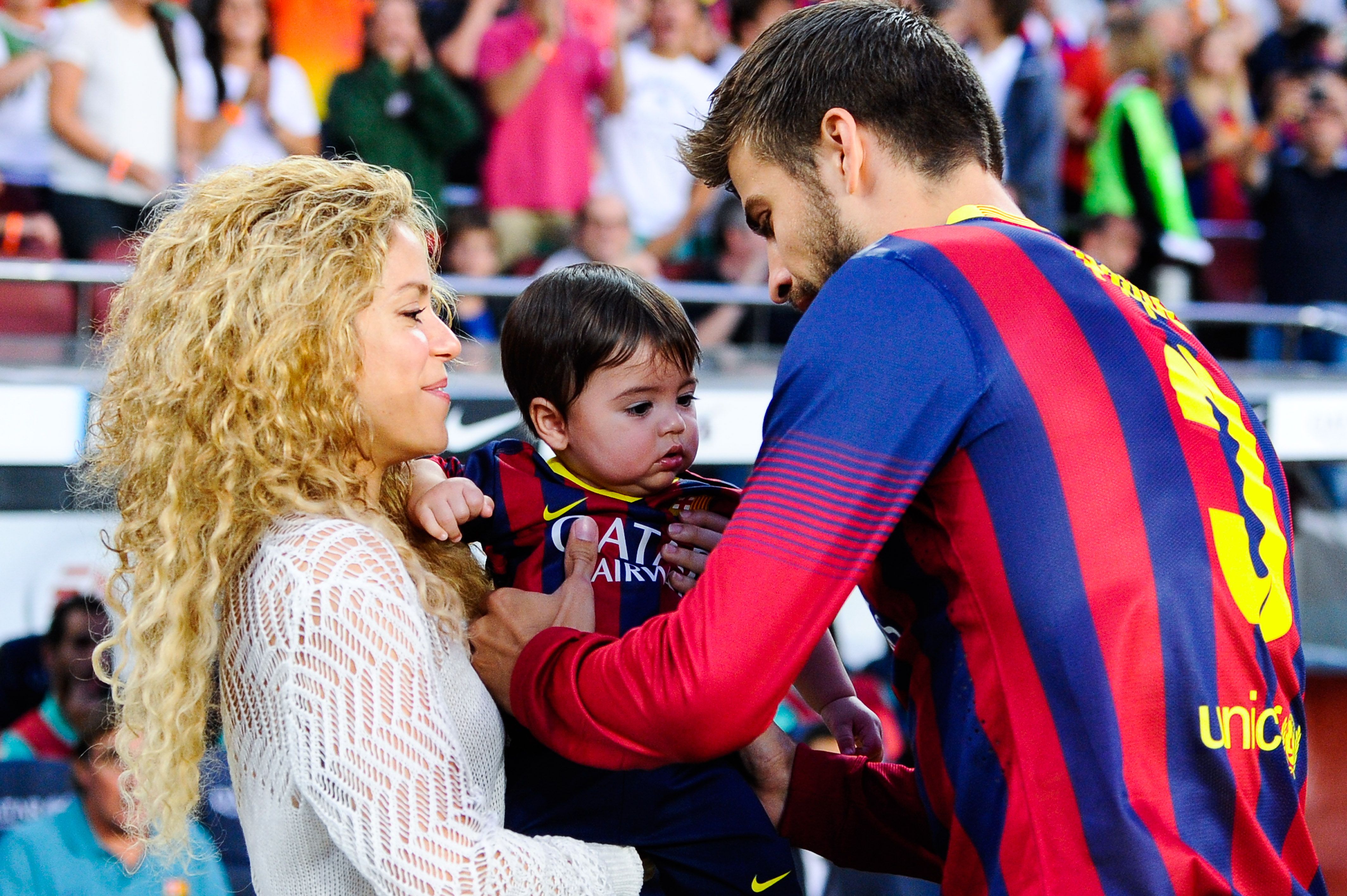 Shakira and Gerard Pique with their son, Milan, during the game between FC Barcelona and Sevilla FC at Camp Nou on September 14, 2013 in Barcelona, Spain. | Source: Getty Images