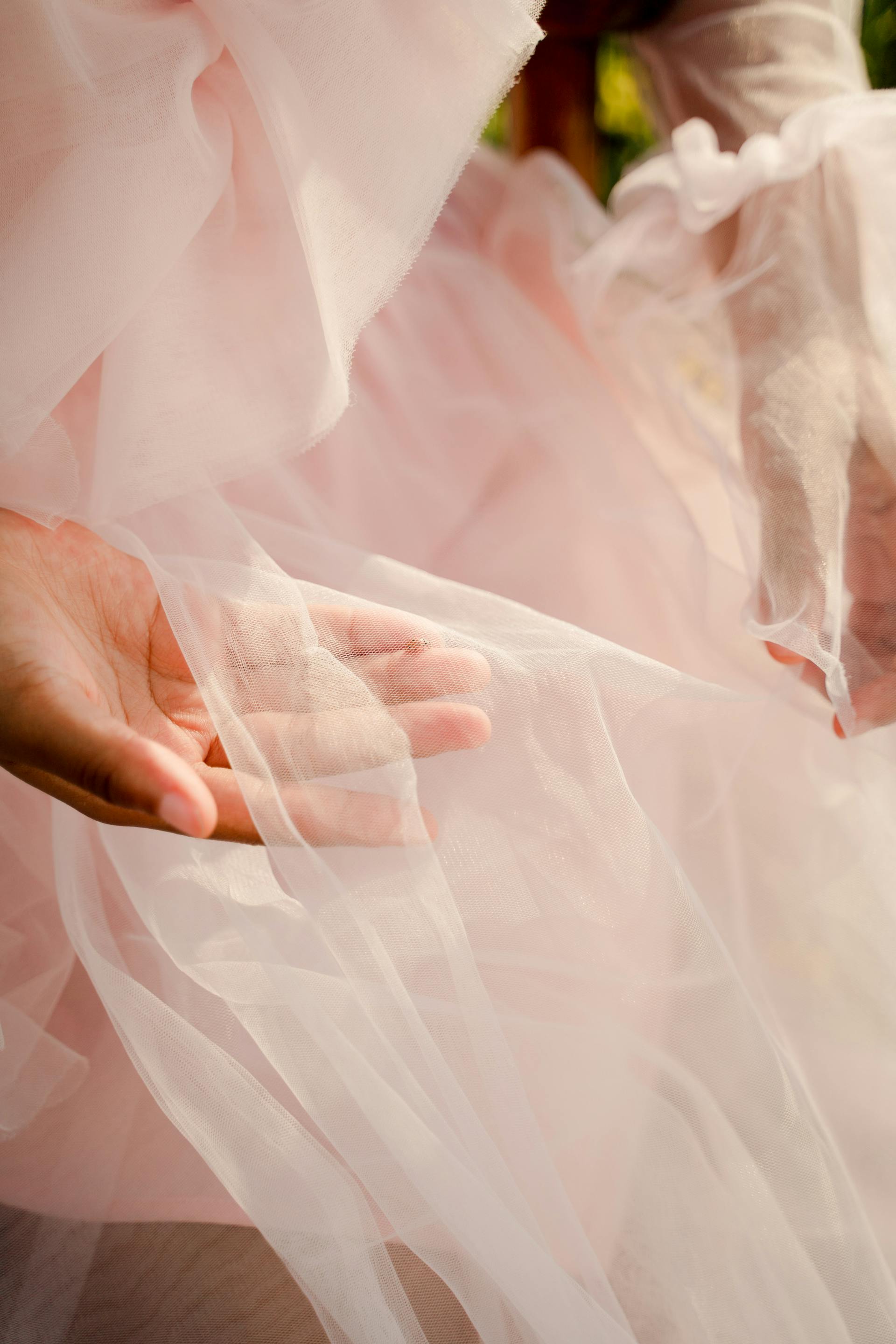 A person holding pink tulle | Source: Pexels