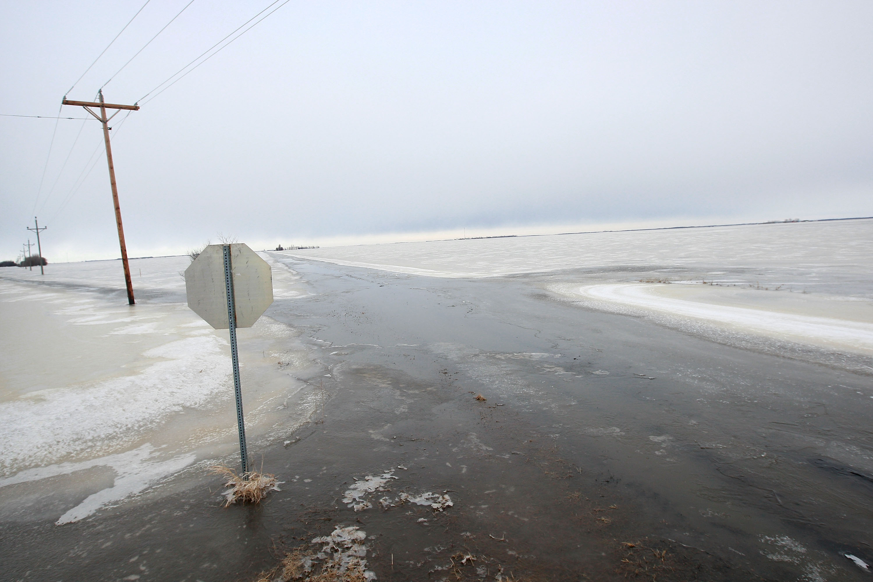 Ice covers a flooded road near Fargo, North Dakota,on March 30, 2009 | Source: Getty Images