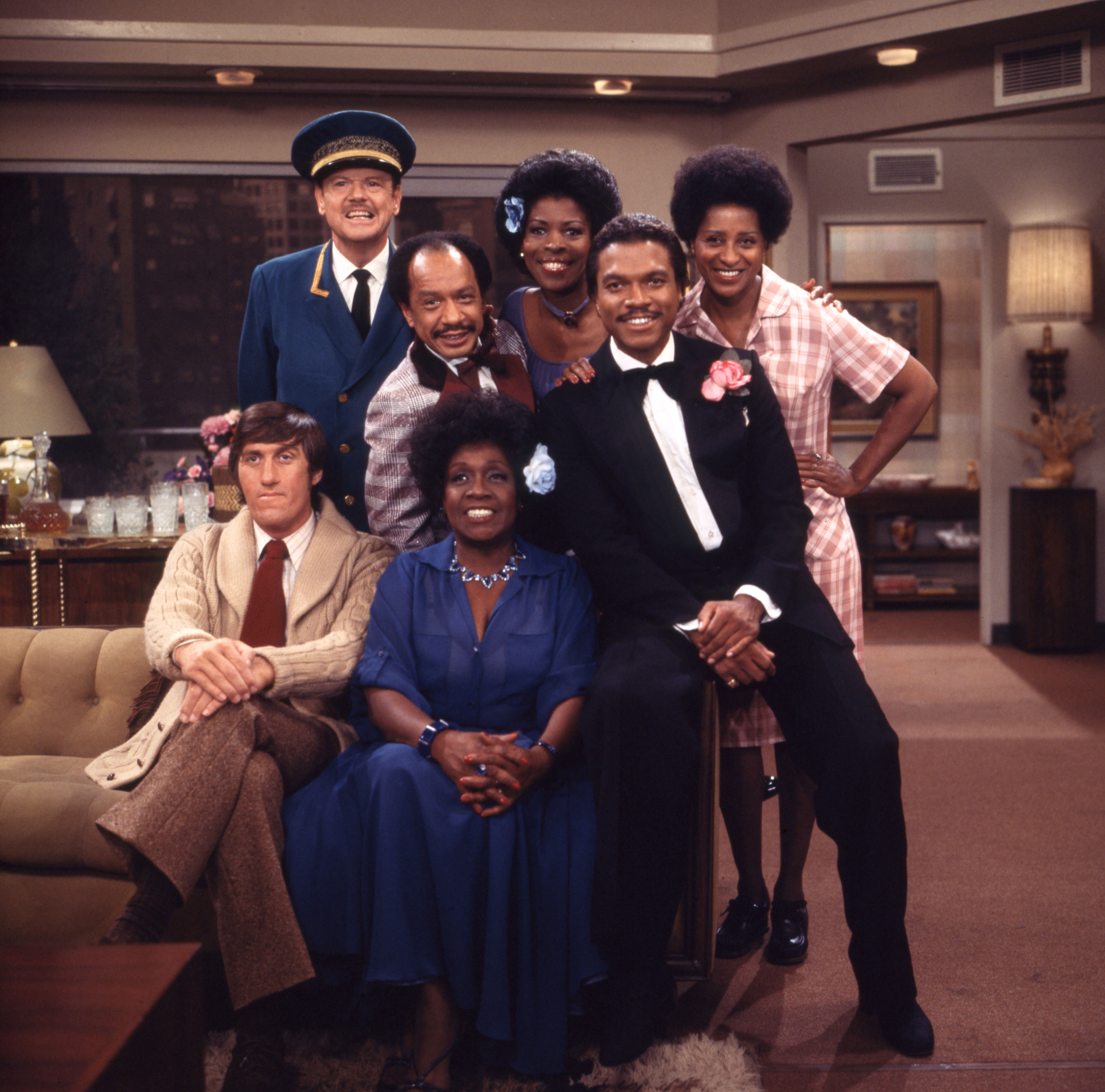 Ned Wertimer (as Ralph Hart), Sherman Hemsley (as George Jefferson), Roxie Roker (as Helen Willis), Marla Gibbs (as Florence Johnston), Paul Benedict (as Harry Bentley), Isabel Sanford (as Louise Jefferson) and guest star, Billy Dee Williams in "The Jeffersons" | Photo: CBS via Getty Images