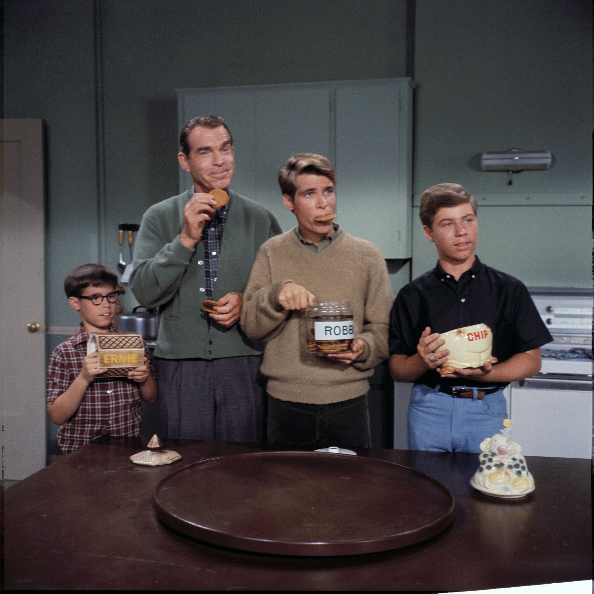 The cast of "My Three Sons," Barry Livingston as Ernie Thompson Douglas, Fred MacMurray as Steve Douglas, Don Grady as Robbie Douglas, and Stanley Livingston as Chip Douglas, were pictured while filming. | Source: Getty Images