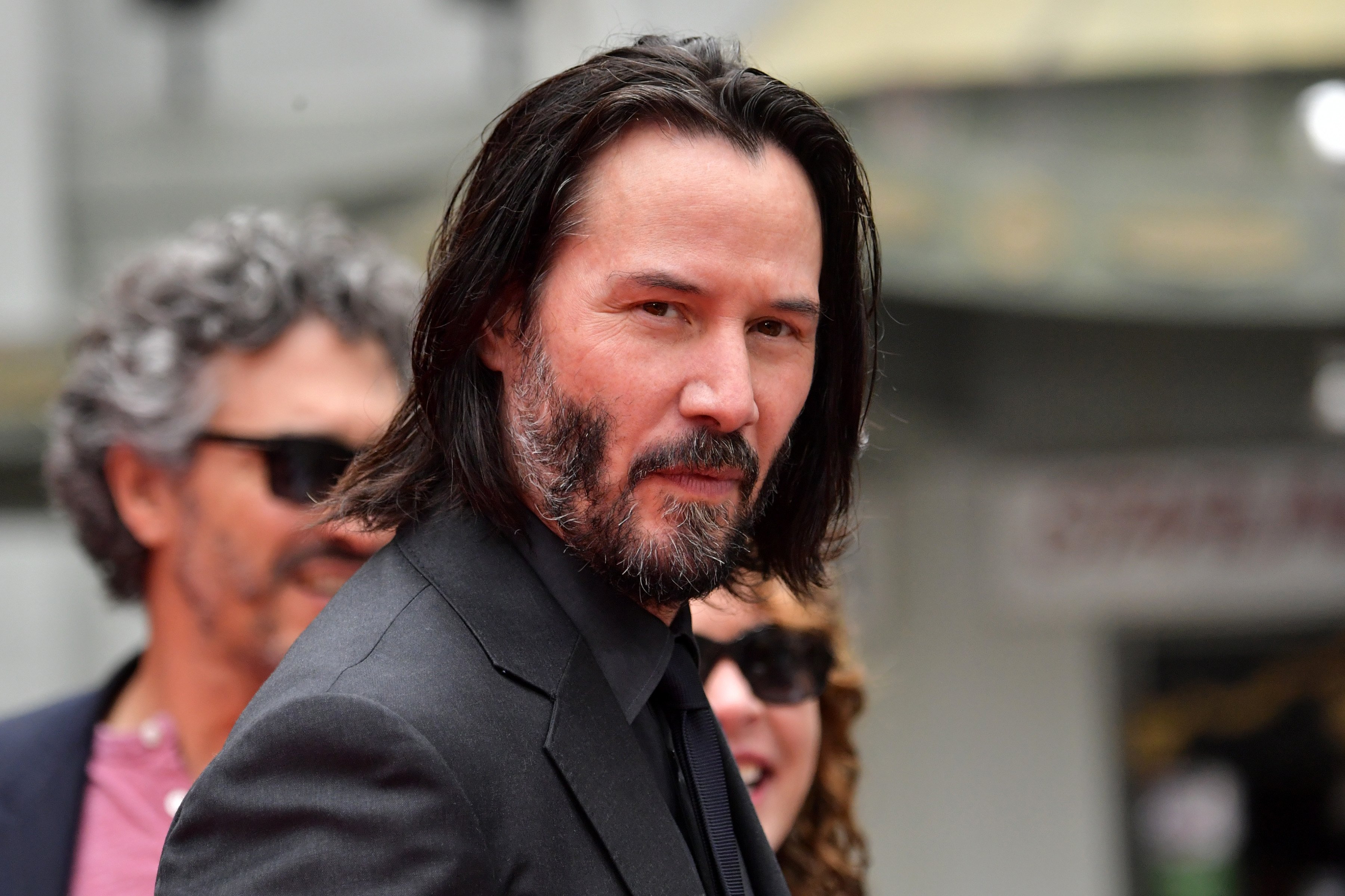Keanu Reeves arrives for his handprint ceremony on May 14, 2019, in Hollywood, California. | Source: Getty Images.