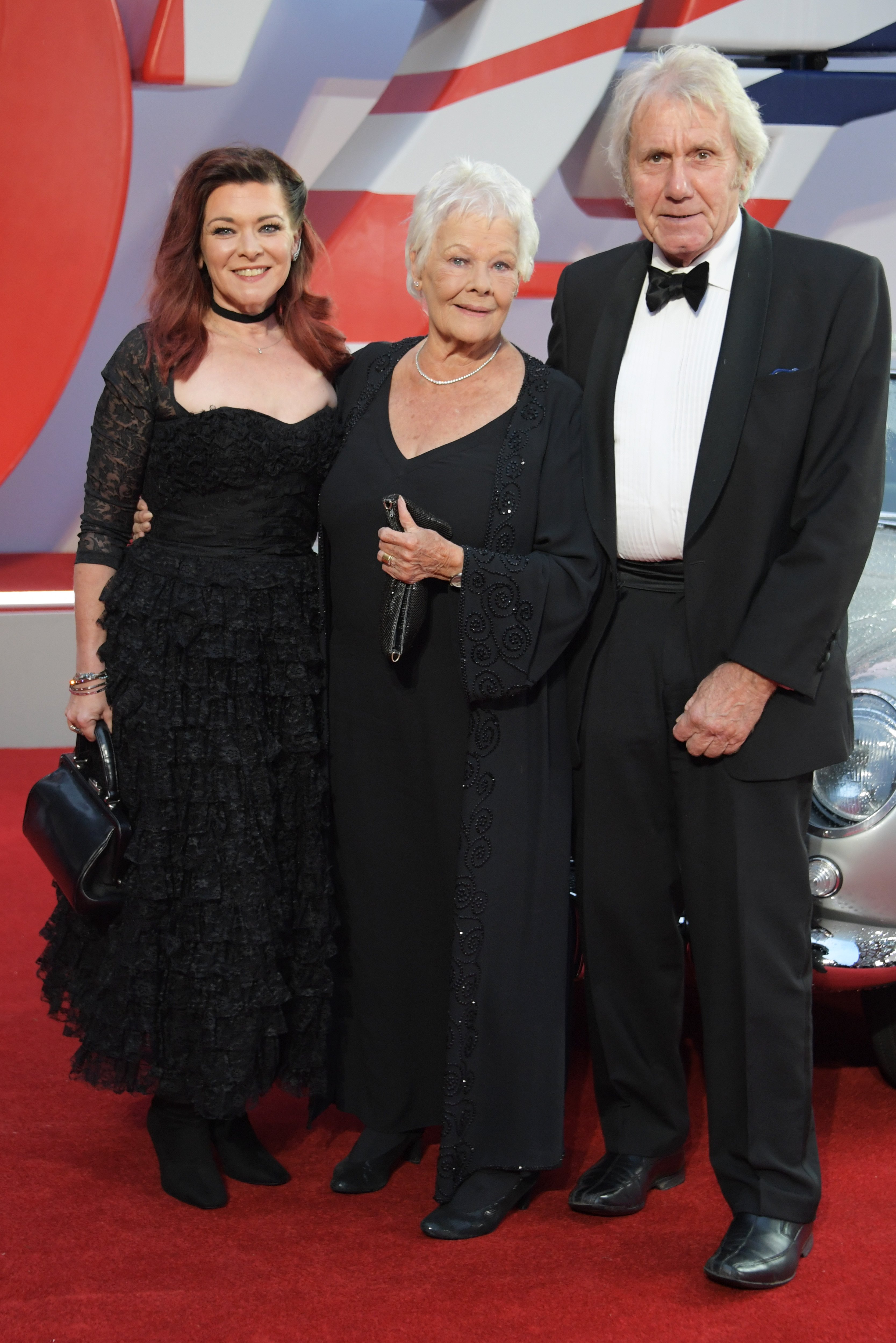 Finty Williams, Judi Dench and David Mills attend the World Premiere of "No Time To Die" at the Royal Albert Hall on September 28, 2021 in London, England ┃Source: Getty Images