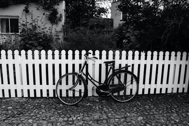 Bicycle parked in front of fence | Source: Pexels