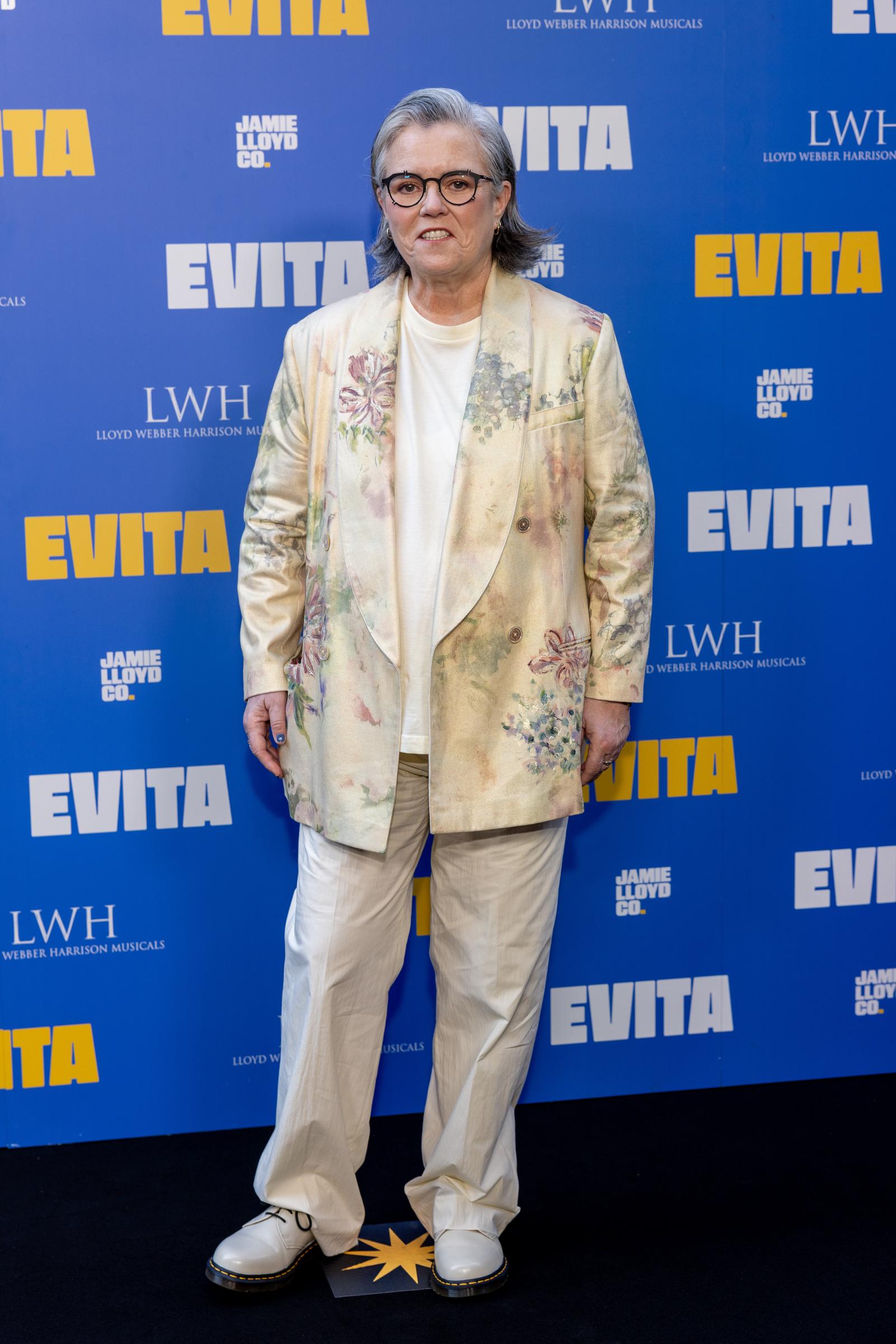 Rosie O'Donnell embraced soft elegance at the "Evita" opening on July 1, 2025, in London. Wearing a cream floral blazer and light trousers, she showcased grown, styled silver hair that framed her calm, radiant expression.