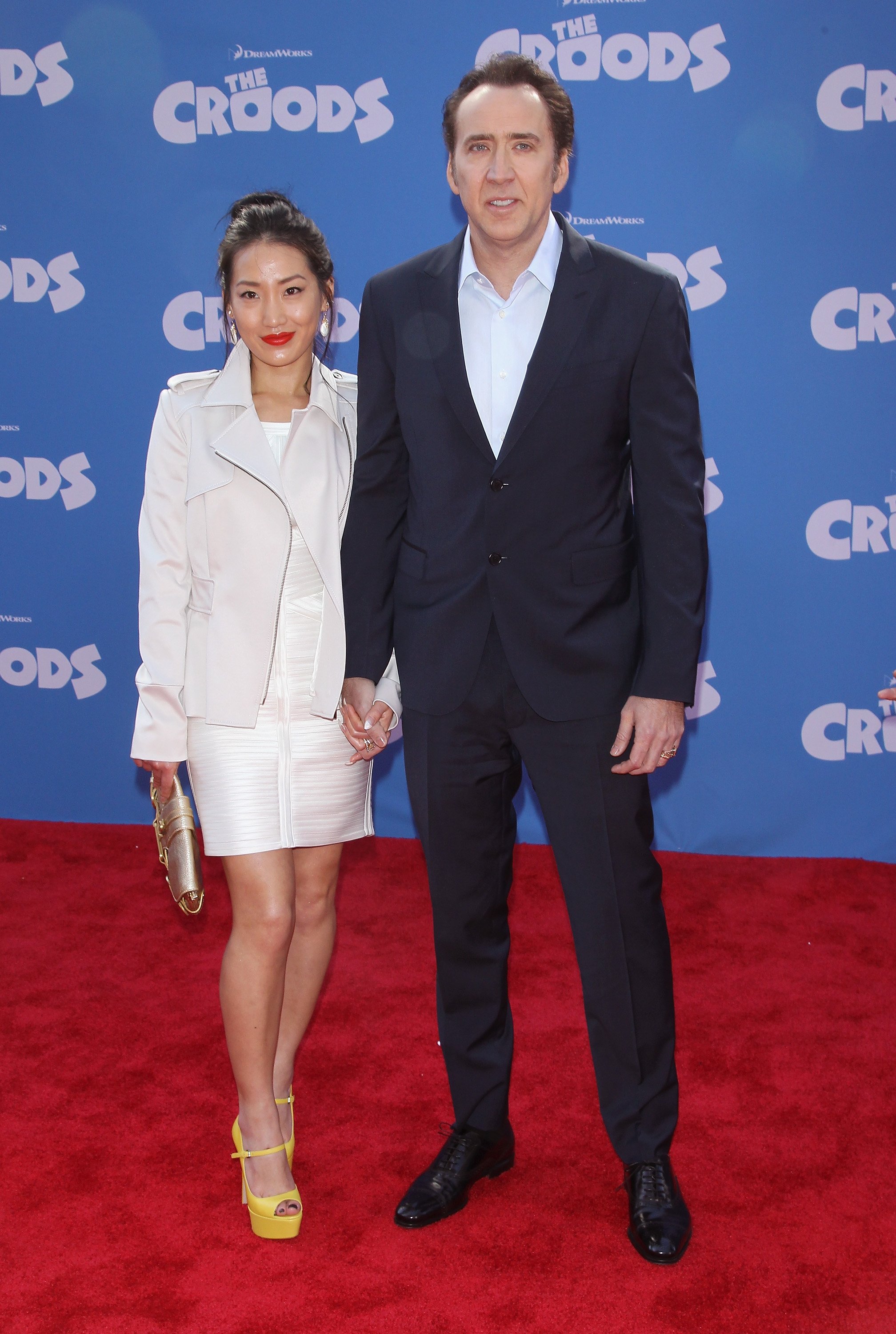 Alice Kim and Nicolas Cage at the premiere of "The Croods" in New York City on March 10, 2013 | Source: Getty Images 