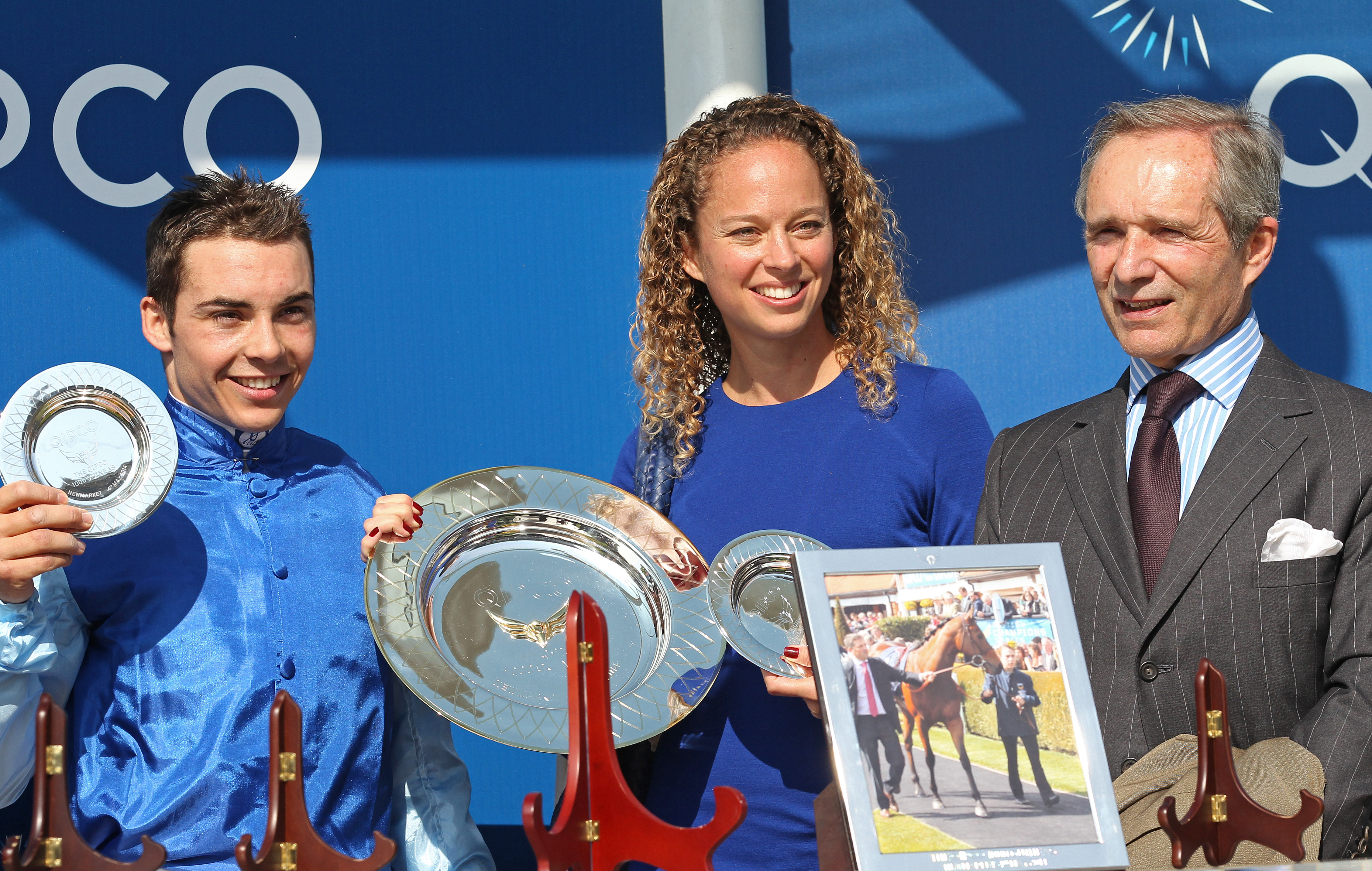 Maxime Guyon, Diane Wildenstein, and Andre Fabre pictured with the trophies at Newmarket Rowley Mile on May 4, 2014, in Newmarket, England. | Source: Getty Images