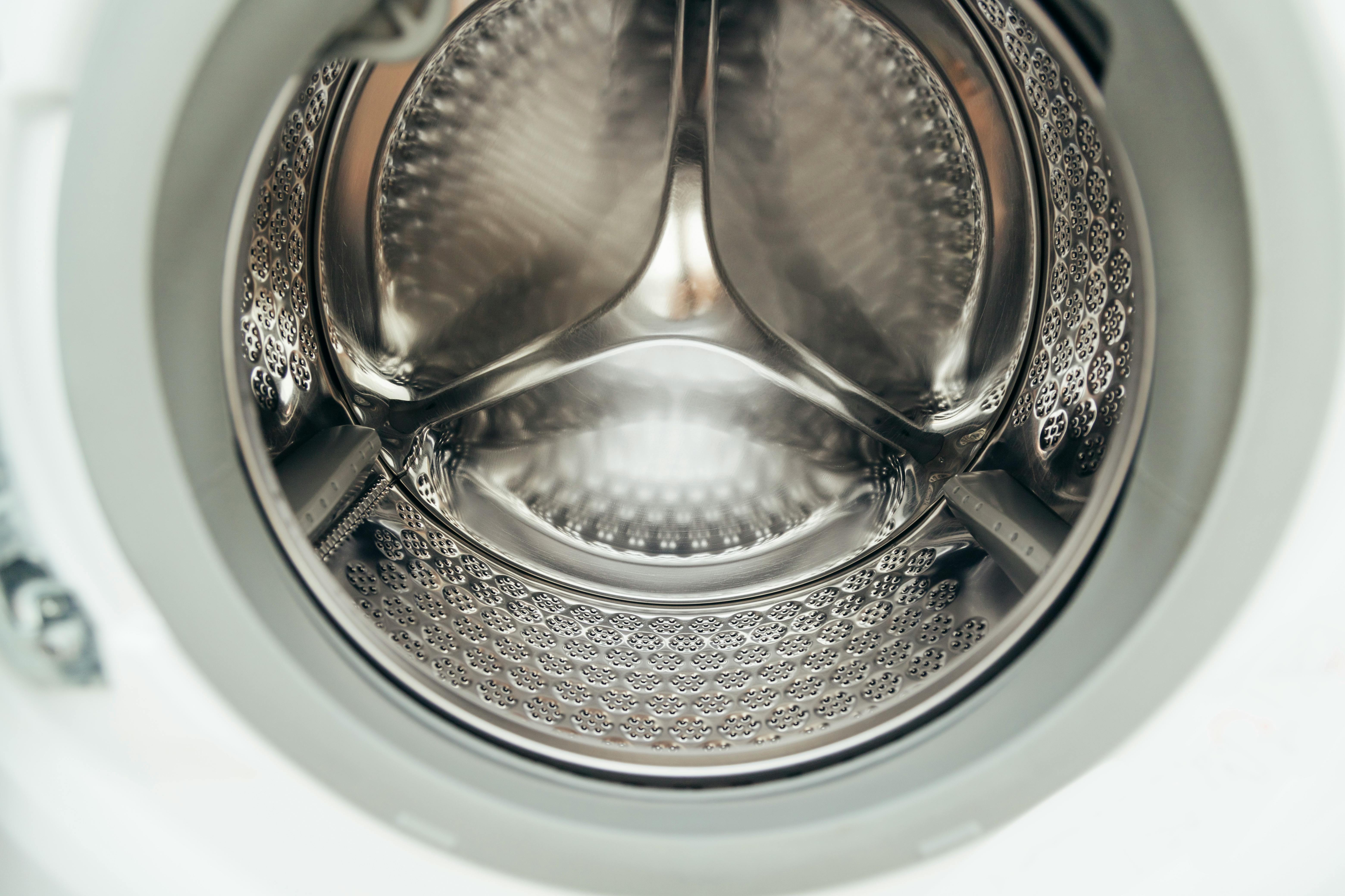 The inside of a washing machine drum highlights hidden areas where moisture can lead to mould build-up. | Source: Pexels