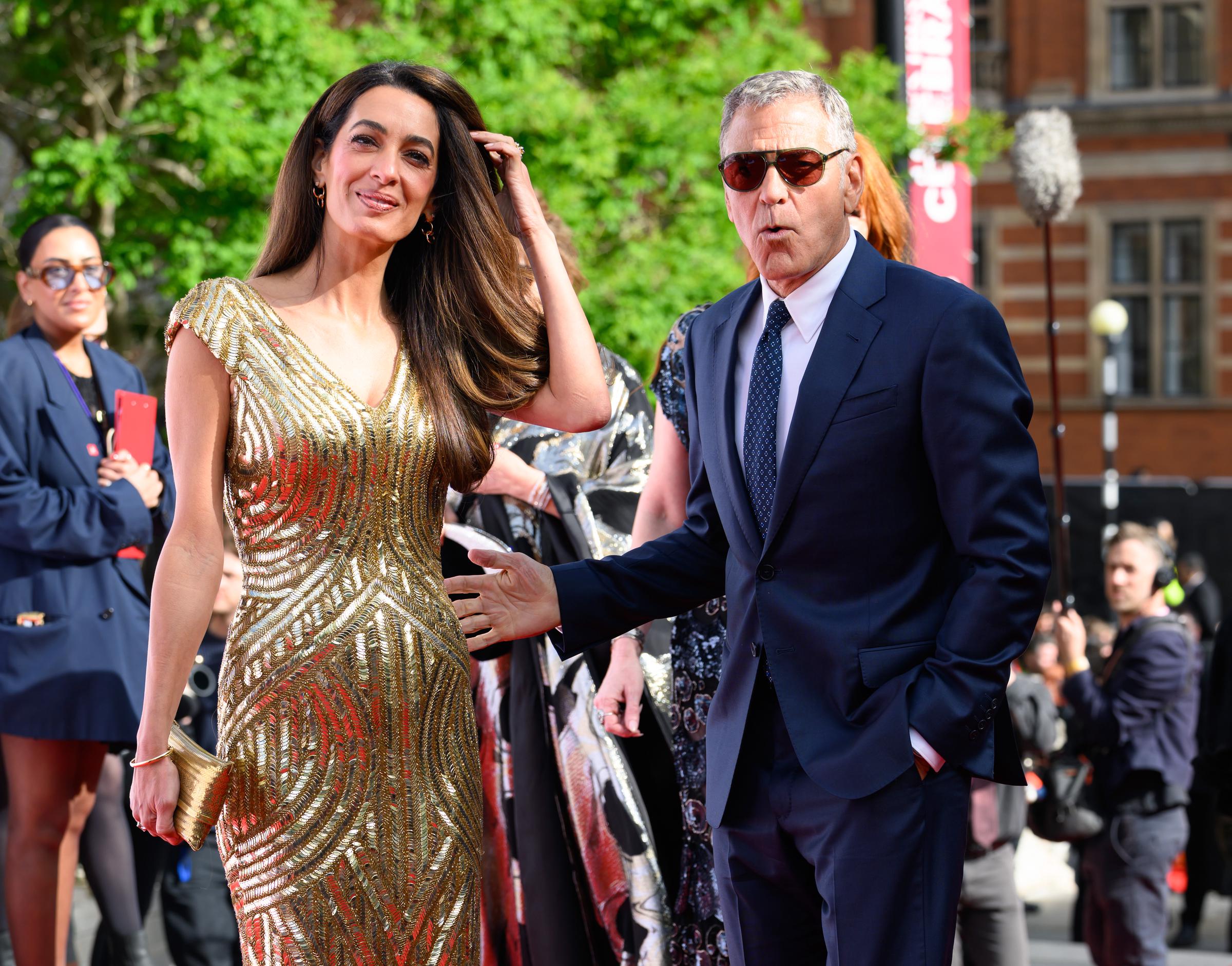 Amal and George Clooney make a stylish appearance on the red carpet at Royal Albert Hall on May 11, 2026 | Source: Getty Images
