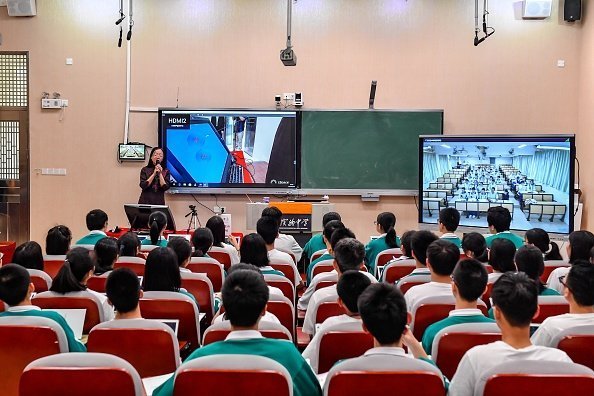  Students listening attentively in a lecture hall | Photo: Getty Images