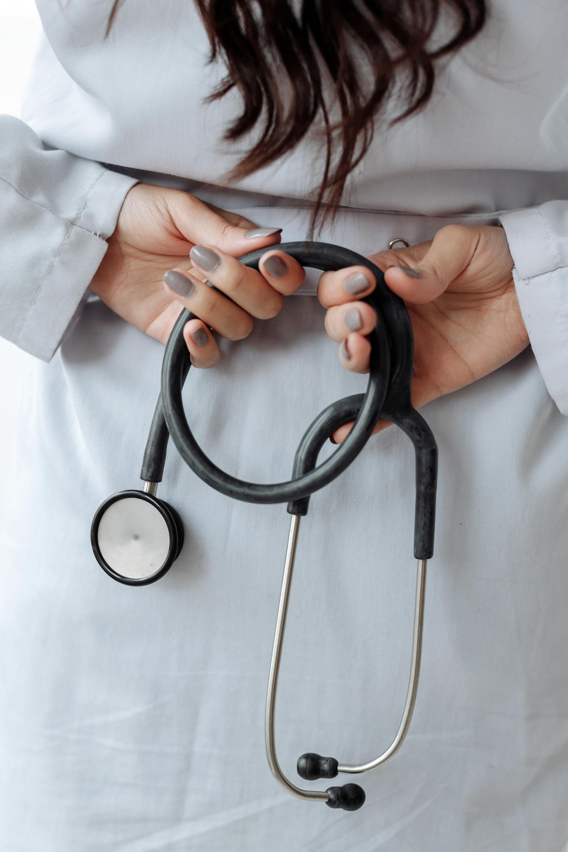 A closeup shot of a female doctor holding a stethoscope | Source: Pexels