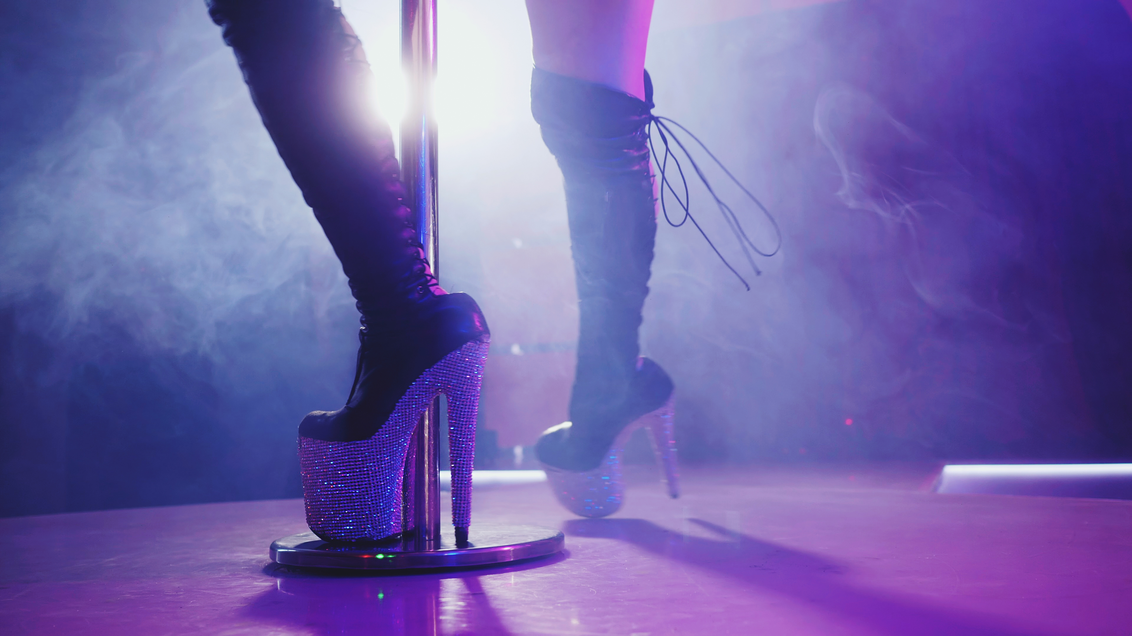 Woman in high boots on platform and heel with rhinestones. | Source: Shutterstock