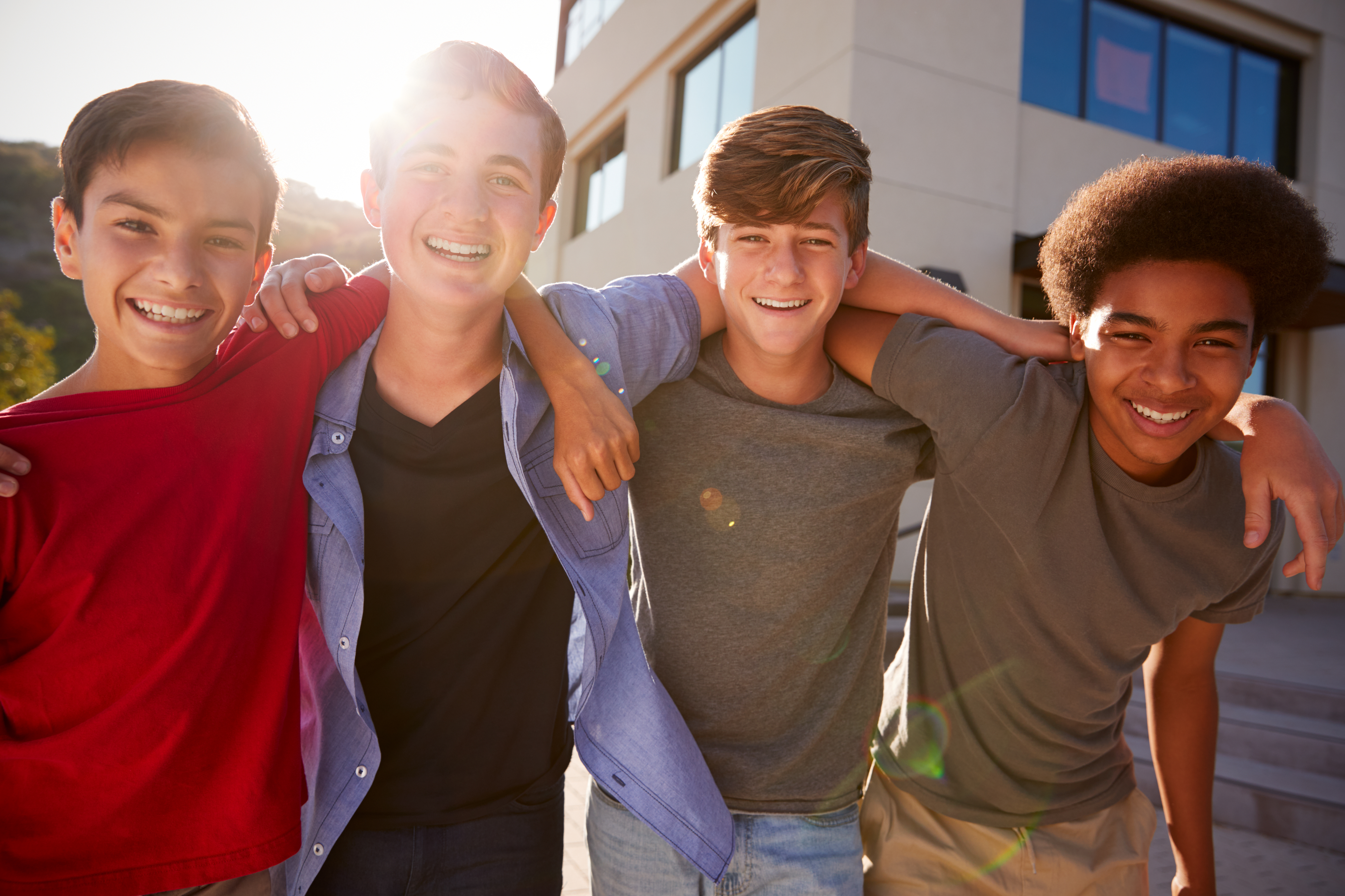 A group of high school boys laughing | Source: Shutterstock
