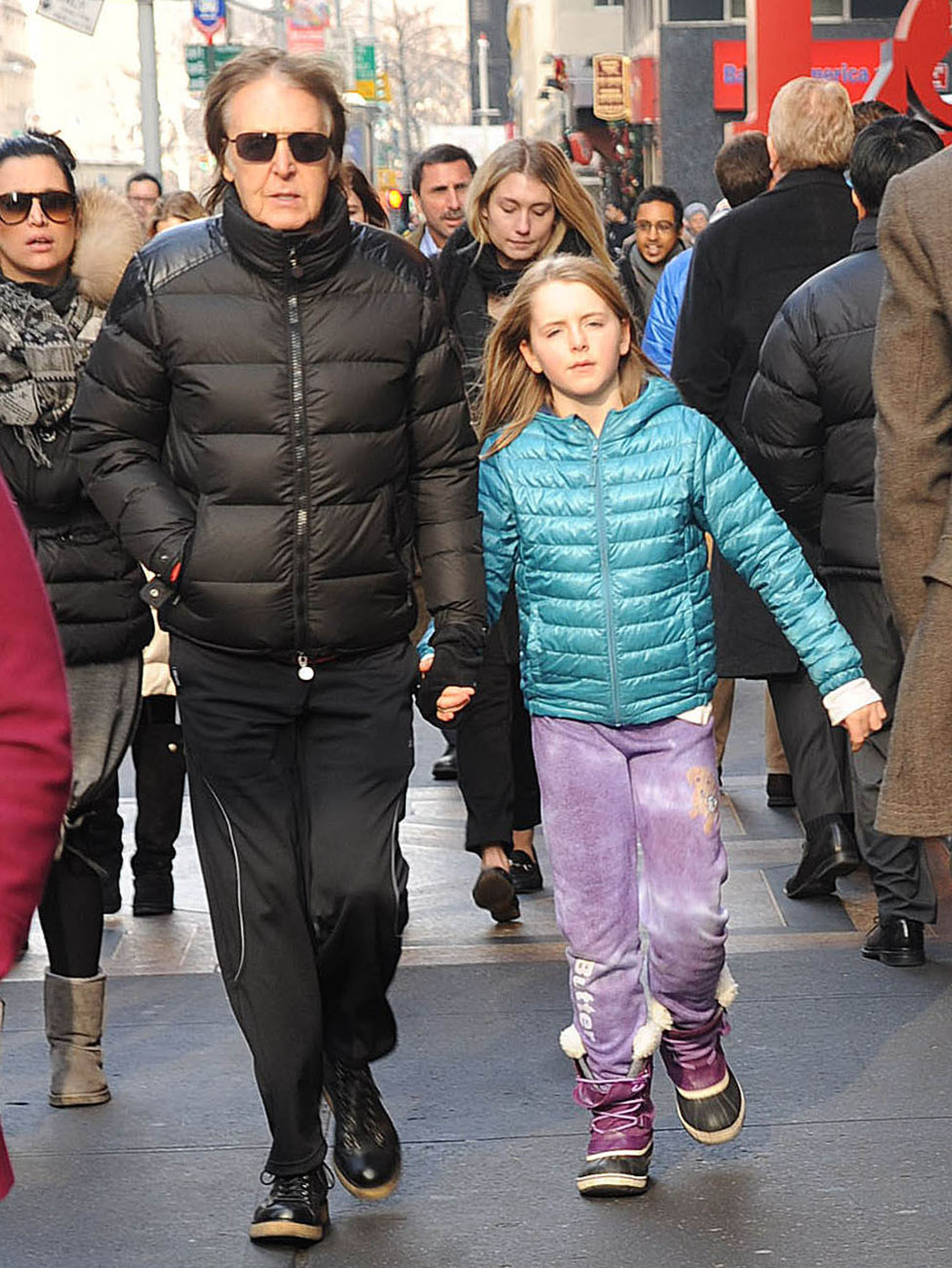  Musician Sir Paul McCartney and his daughter, Beatrice McCartney, are seen on December 19, 2013 in New York City. | Source: Getty Images