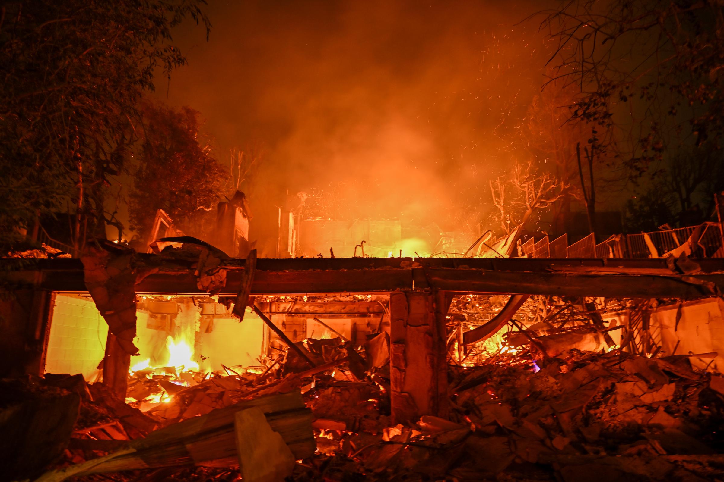 A wildfire tears through a home in Pacific Palisades, California on January 8, 2025. | Source: Getty Images