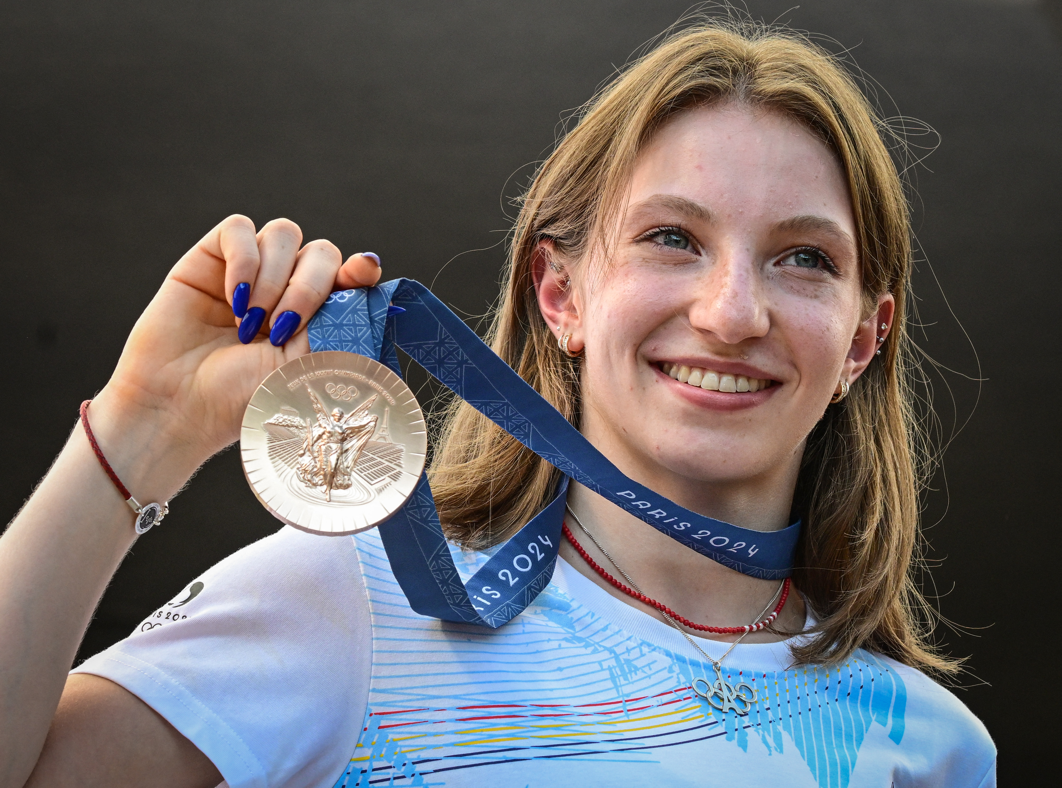 Romanian gymnast Ana Maria Barbosu poses with her Olympic bronze medal she was given on August 16, 2024 in Bucharest, Romania | Source: Getty Images