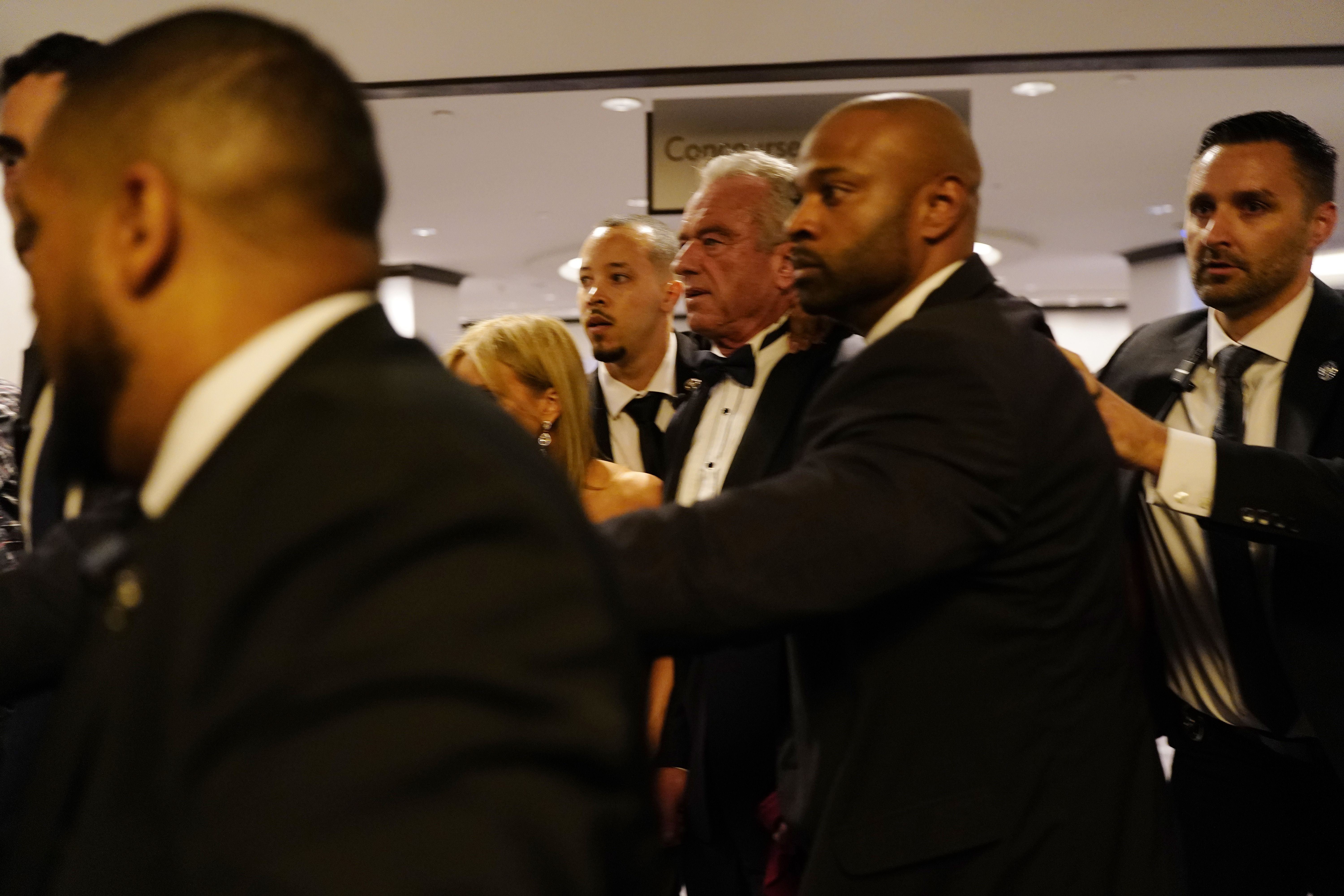 Robert F. Kennedy Jr. is escorted by federal agents after an incident during the White House Correspondents' Dinner at Washington Hilton on April 25, 2026, in Washington, DC | Source: Getty Images