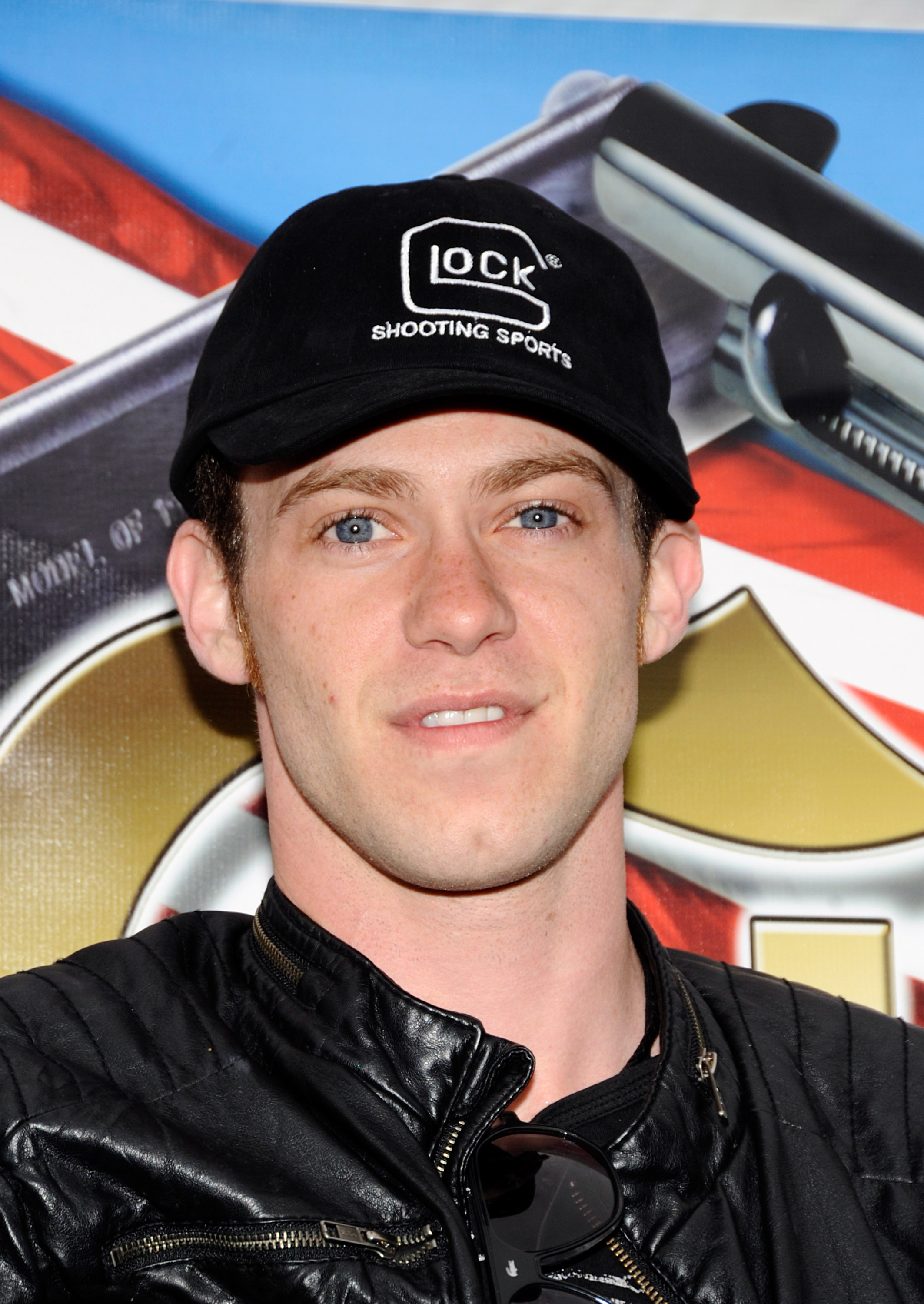 Bug Hall flashes a relaxed smile in a black leather jacket and baseball cap as he poses for a close-up at the Hollywood Celebrity Sporting Clays Invitational, held at the Oak Tree Gun Club in Newhall, California, on 11 June 2011 — taking aim at charity before vanishing from the spotlight.
