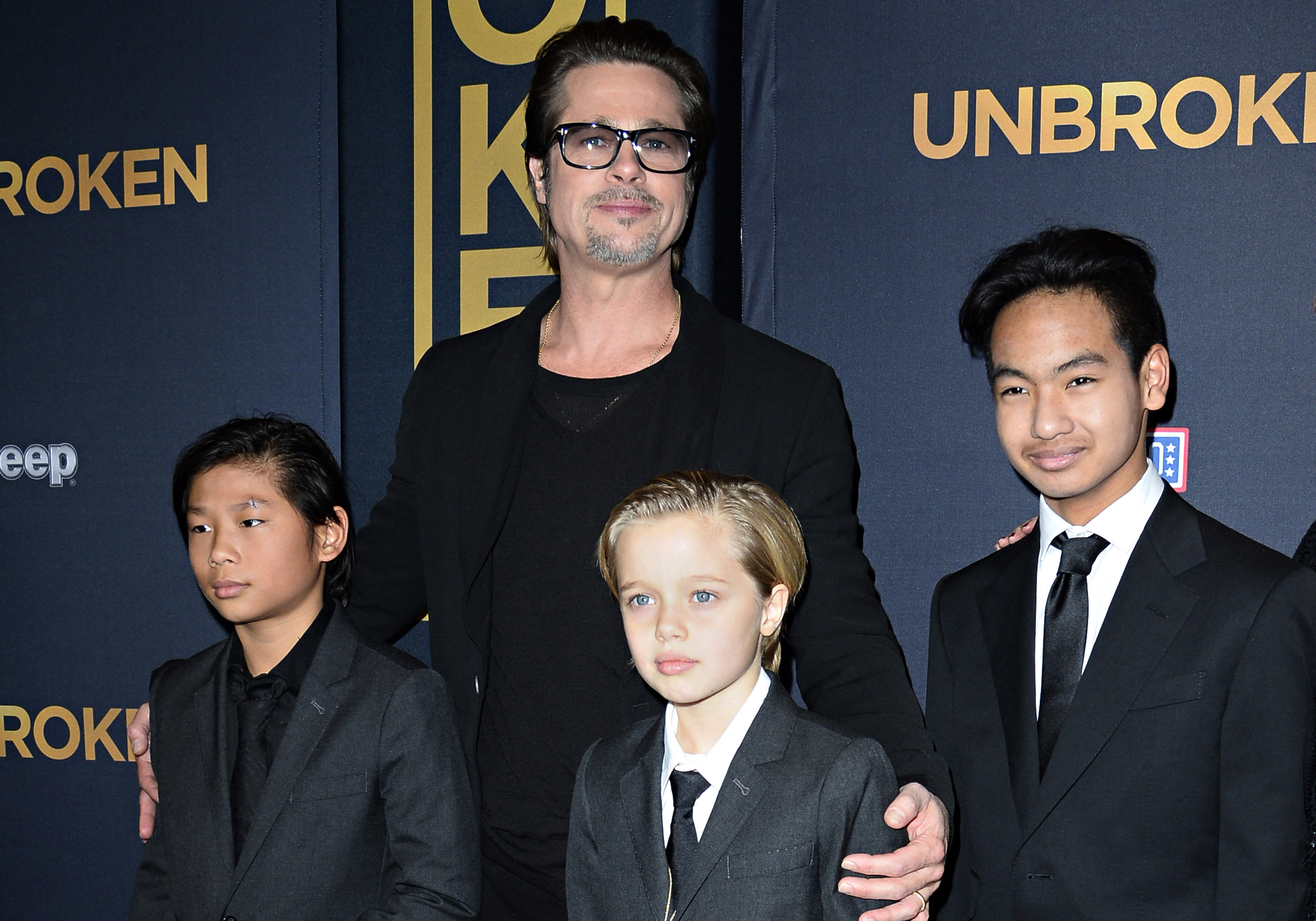 Brad Pitt with his children children Pax, Shiloh, and Maddox at the premiere of "Unbroken," in Los Angeles in 2014 | Source: Getty Images