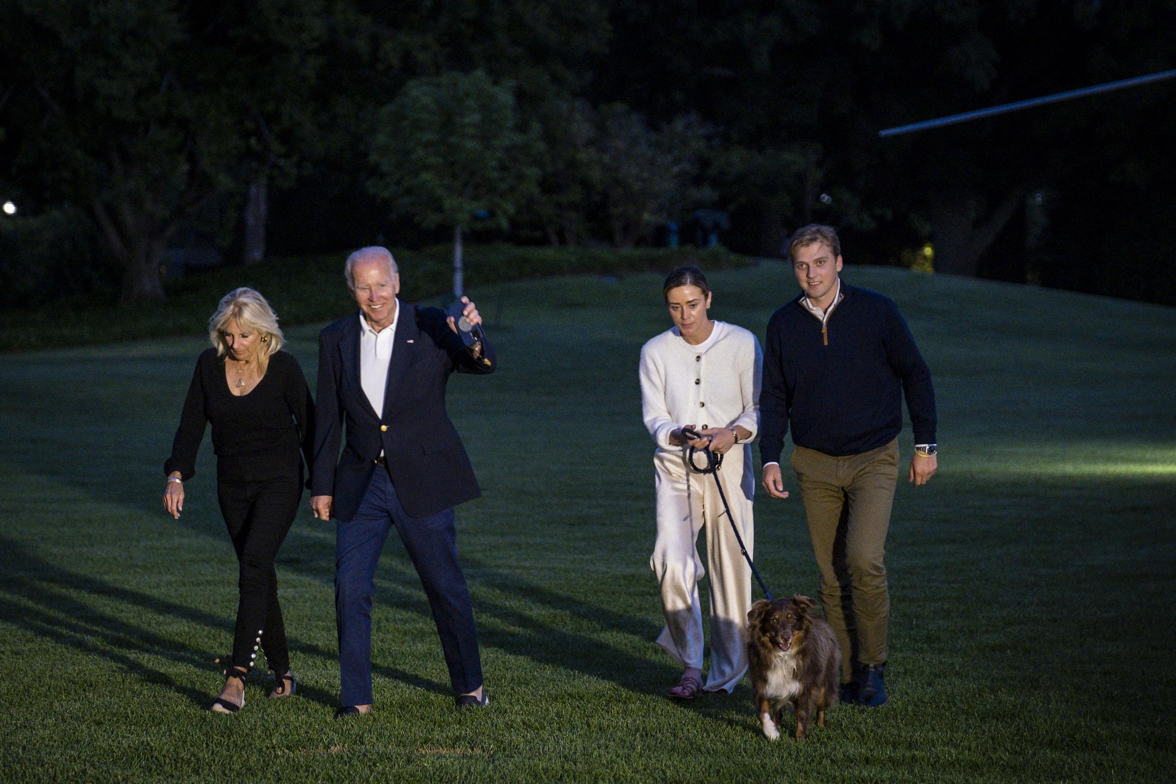 Jill, Joe, and Naomi Biden walking to the White House from Marine One with Peter George Heermann Neal and and their dog, in Washngton, DC. on June 20, 2022. | Source: Getty Images