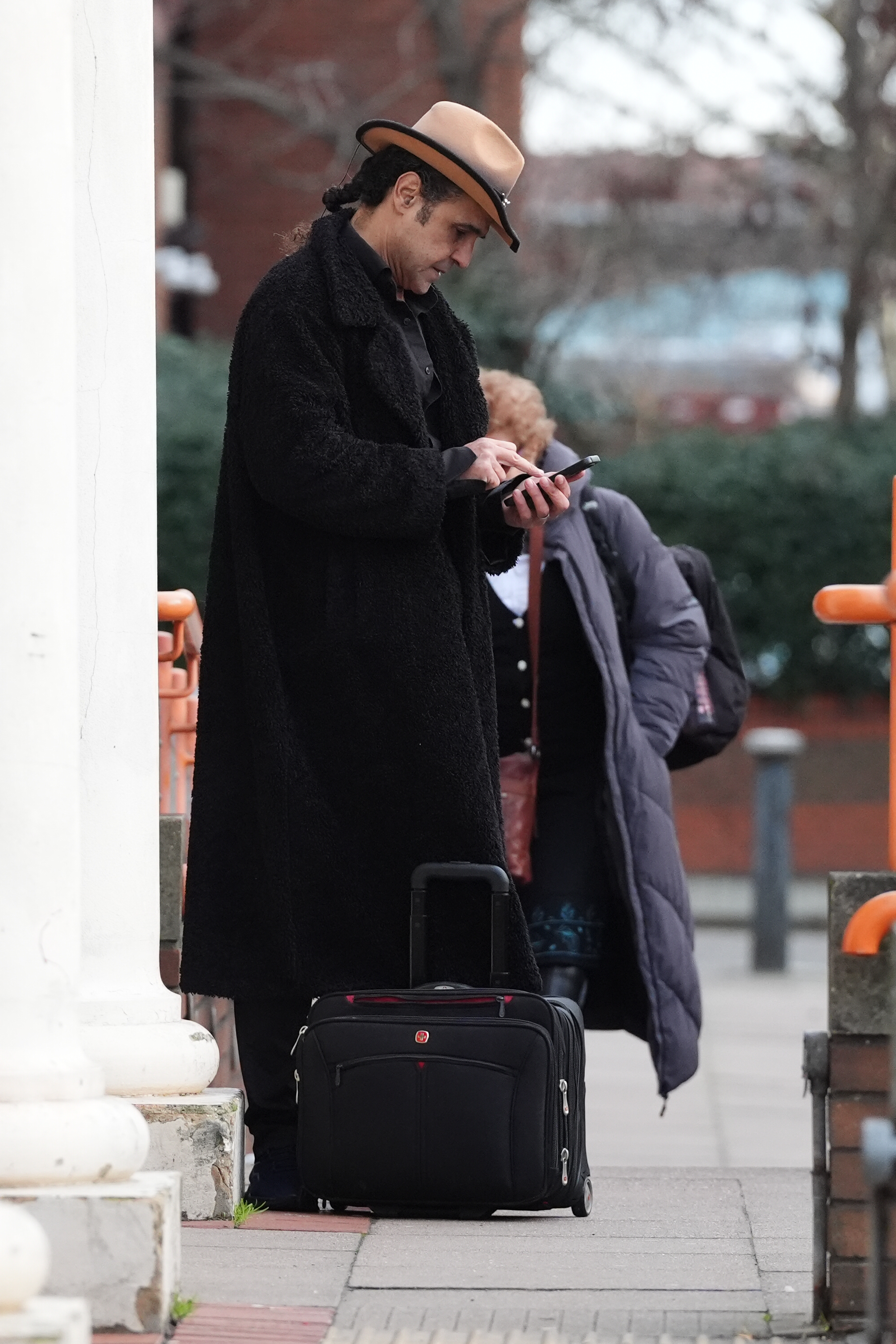 Yousseph "Chico" Slimani was pictured checking his phone outside Willesden Magistrates' Court in north London, England, on 30 December 2025, after being charged with drink driving on 13 December 2025. | Source: Getty Images
