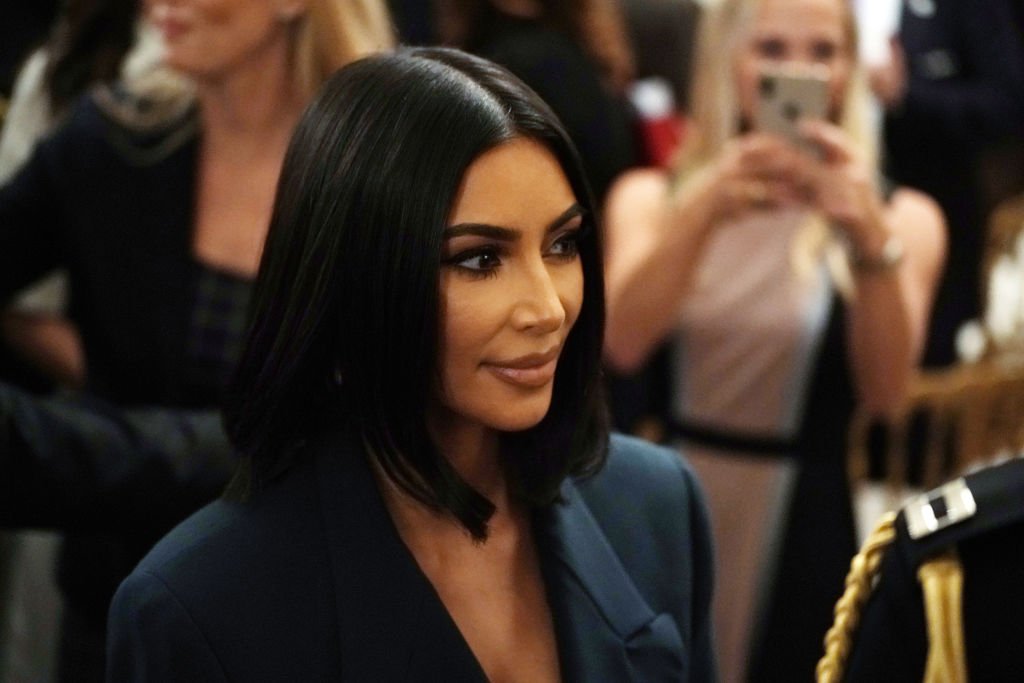 Kim Kardashian West leaves after an East Room event on “second chance hiring” at the White House in Washington, DC | Photo: Getty Images