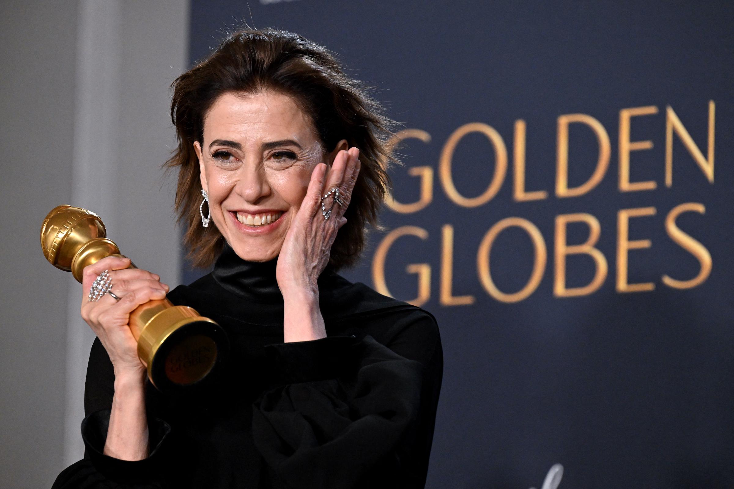 Fernanda Torres her trophy at the 82nd Golden Globes on January 5, 2025 | Source: Getty Imafes