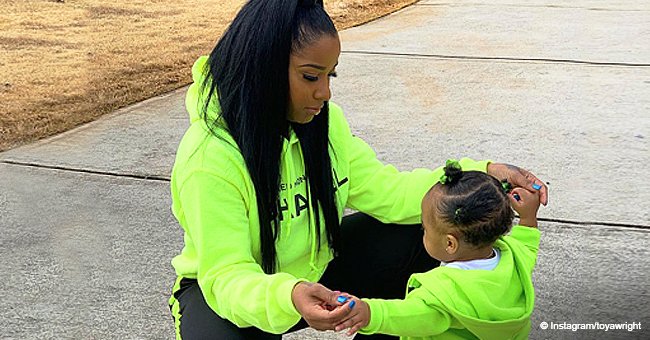 Toya Wright’s daughter Reign looks like mom as they stroll in matching neon green outfits 