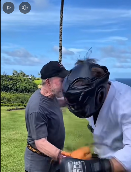 lands a close-range strike during a training drill with his opponent as his opponent recoils. | Source: Facebook/ChuckNorris