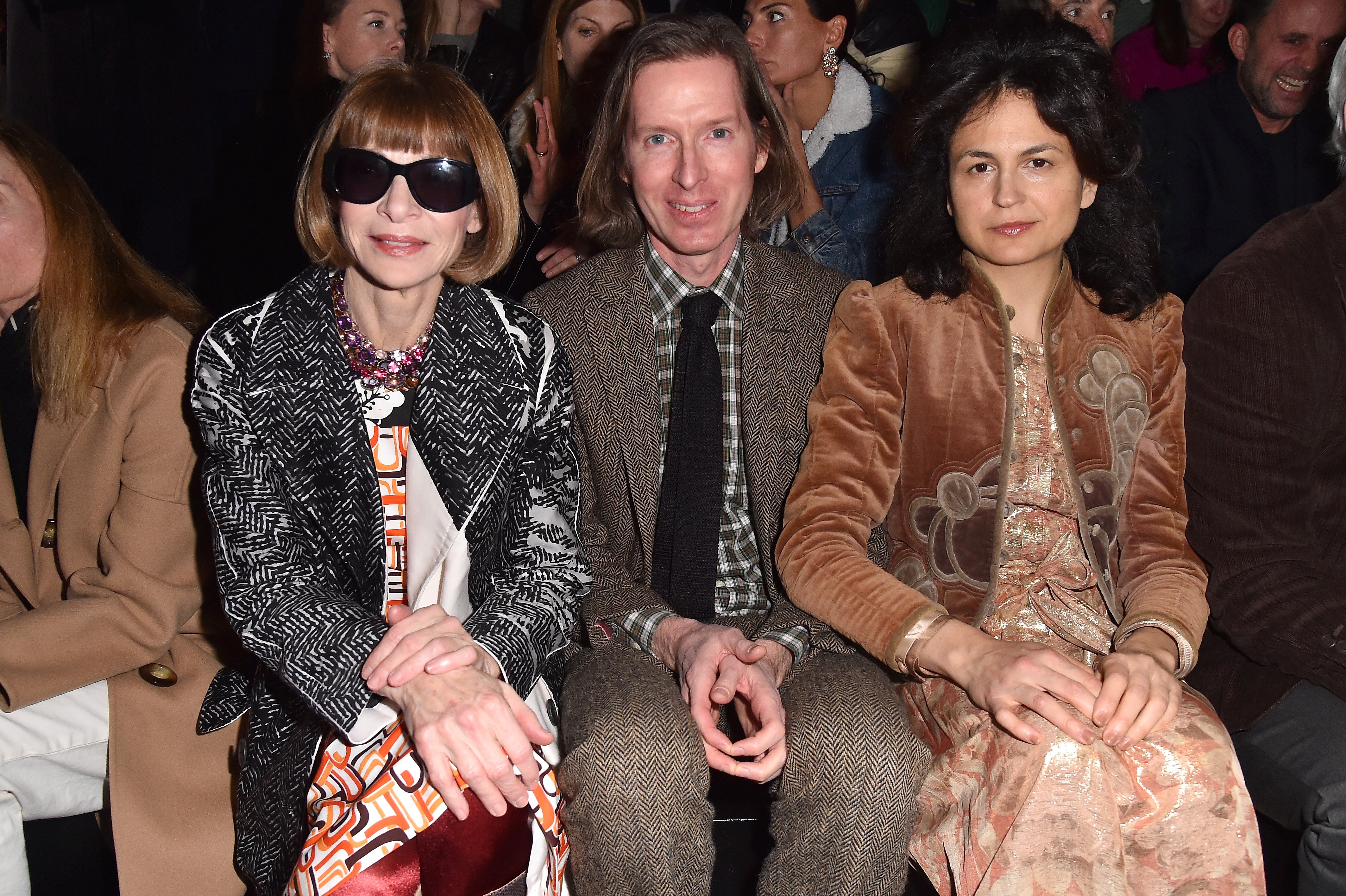Wes Anderson, his wife Juman Malouf and Anna Wintour, at Prada Fall/Winter 2018 Womenswear Fashion Show on February 22, 2018 in Milan. | Source: Getty Images