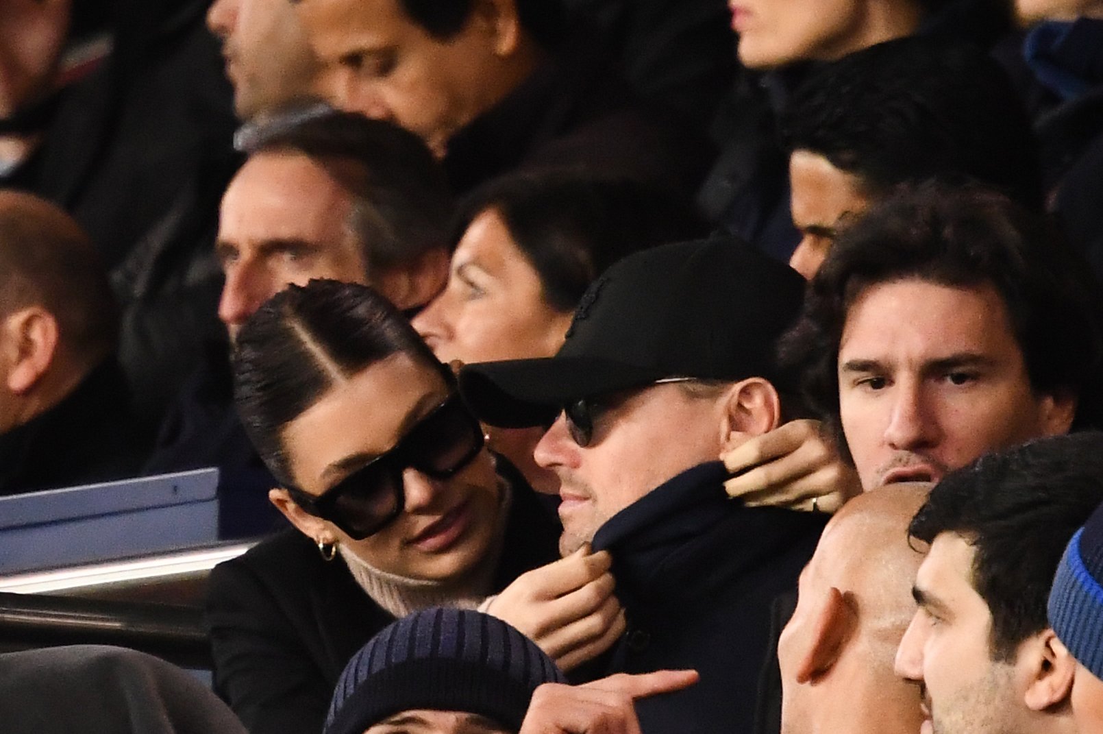 Leonardo Di Caprio and former partner, Camilla Morrone, were photographed while she adjusted his coat's collar at the UEFA Champions League Group C football match between Paris Saint-Germain (PSG) and Liverpool FC in 2018 | Source: Getty Images