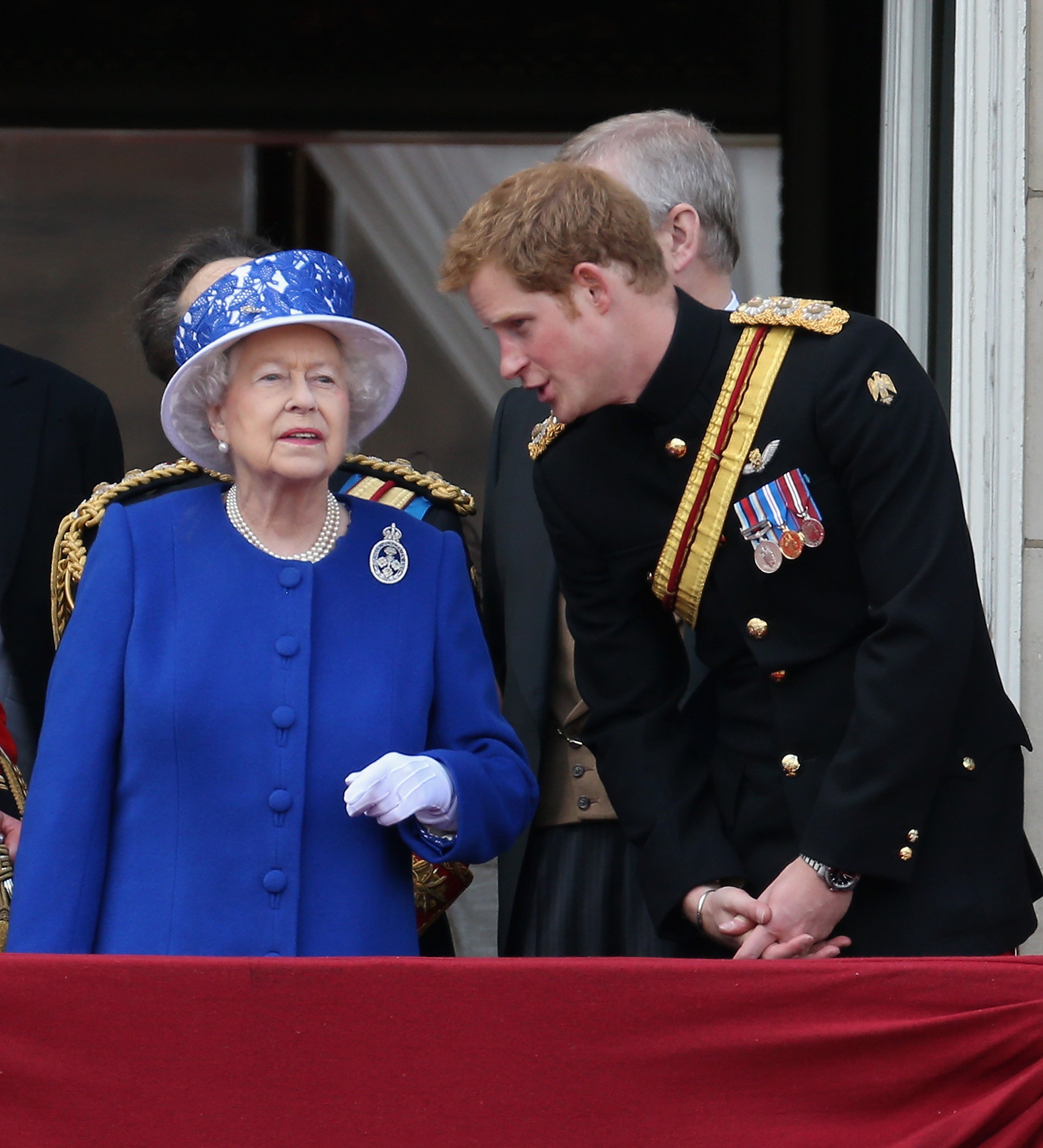 Prince Harry chats to Queen Elizabeth II on the balcony of Buckingham Palace during the annual Trooping the Colour Ceremony on June 15, 2013 in London, England. | Source: Getty Images