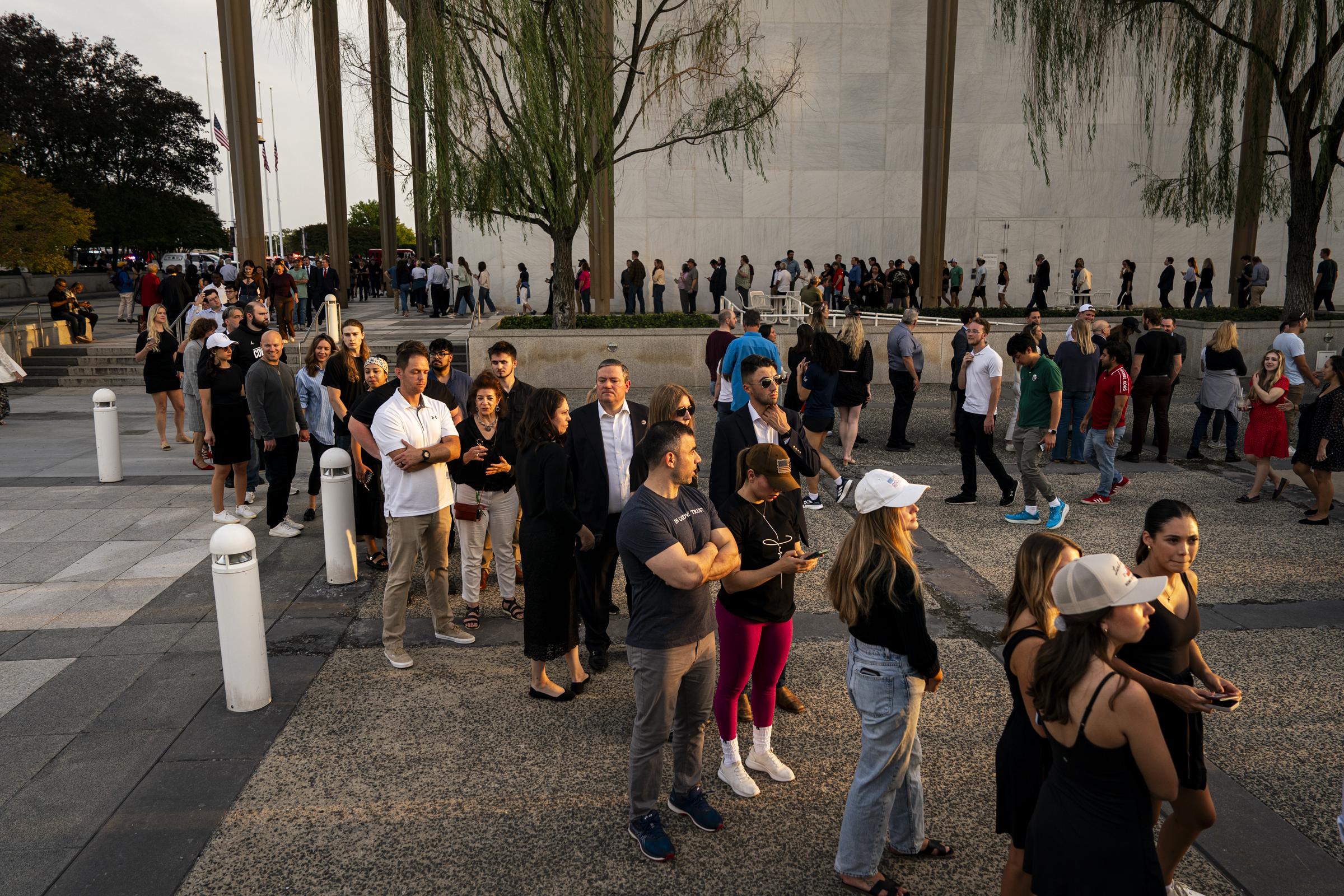 People wait in line prior to a prayer vigil for Charlie Kirk outside the Kennedy Center in Washington, DC on September 14, 2025 | Source: Getty Images