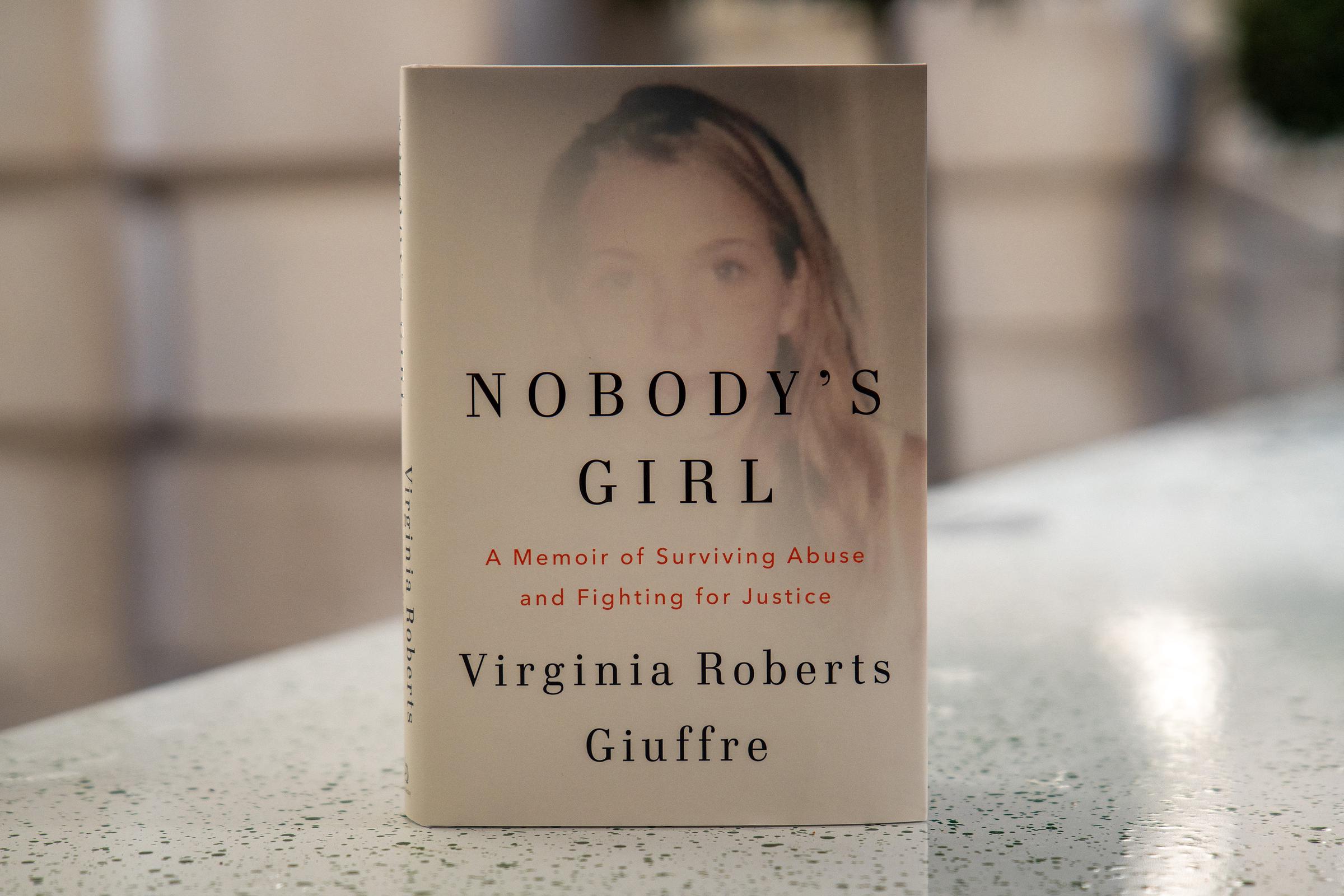 A copy of the book "Nobody's Girl - A Memoir of Surviving Abuse and Fighting for Justice" by Virginia Giuffre, is pictured on October 21, 2025, in London, England. | Source: Getty Images