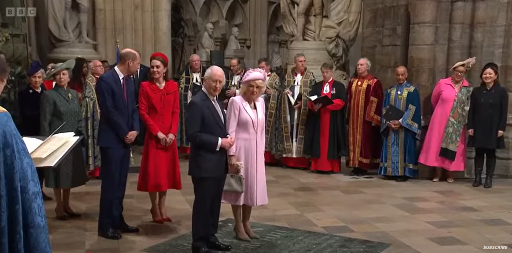 Prince William whispering something to Princess Catherine while standing behind King Charles and Camilla, Queen Consort, during the annual Service of Celebration for Commonwealth Day on March 10, 2025 | Source: YouTube/BBC